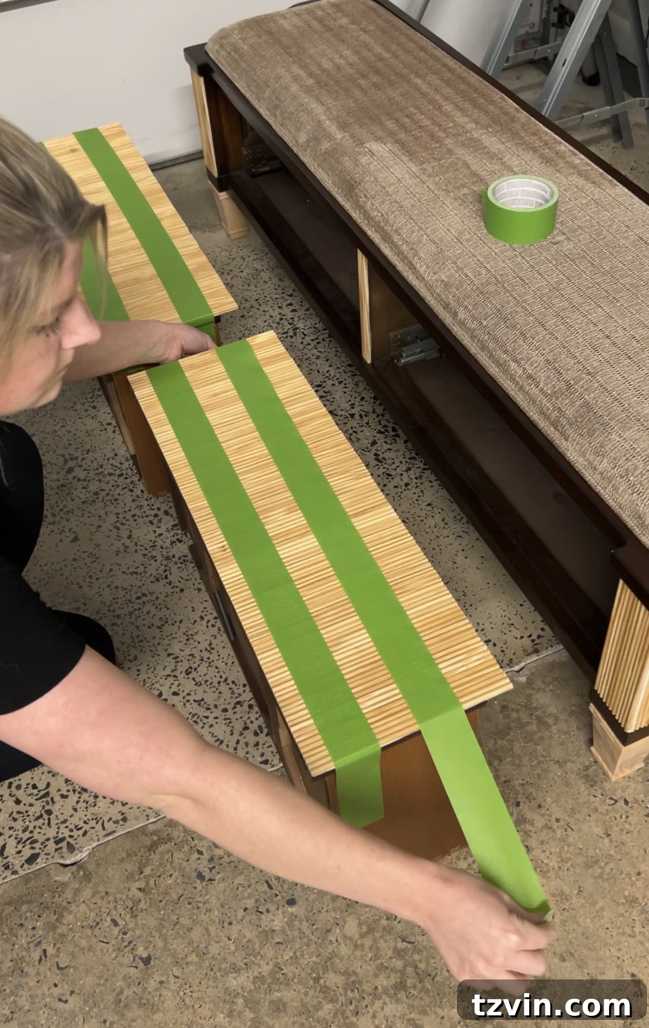 Reeded Elegance: A Shoe Storage Bench Makeover 14 Applying decorative reeding to the drawer fronts of a storage bench using construction adhesive, showcasing the precision needed for alignment