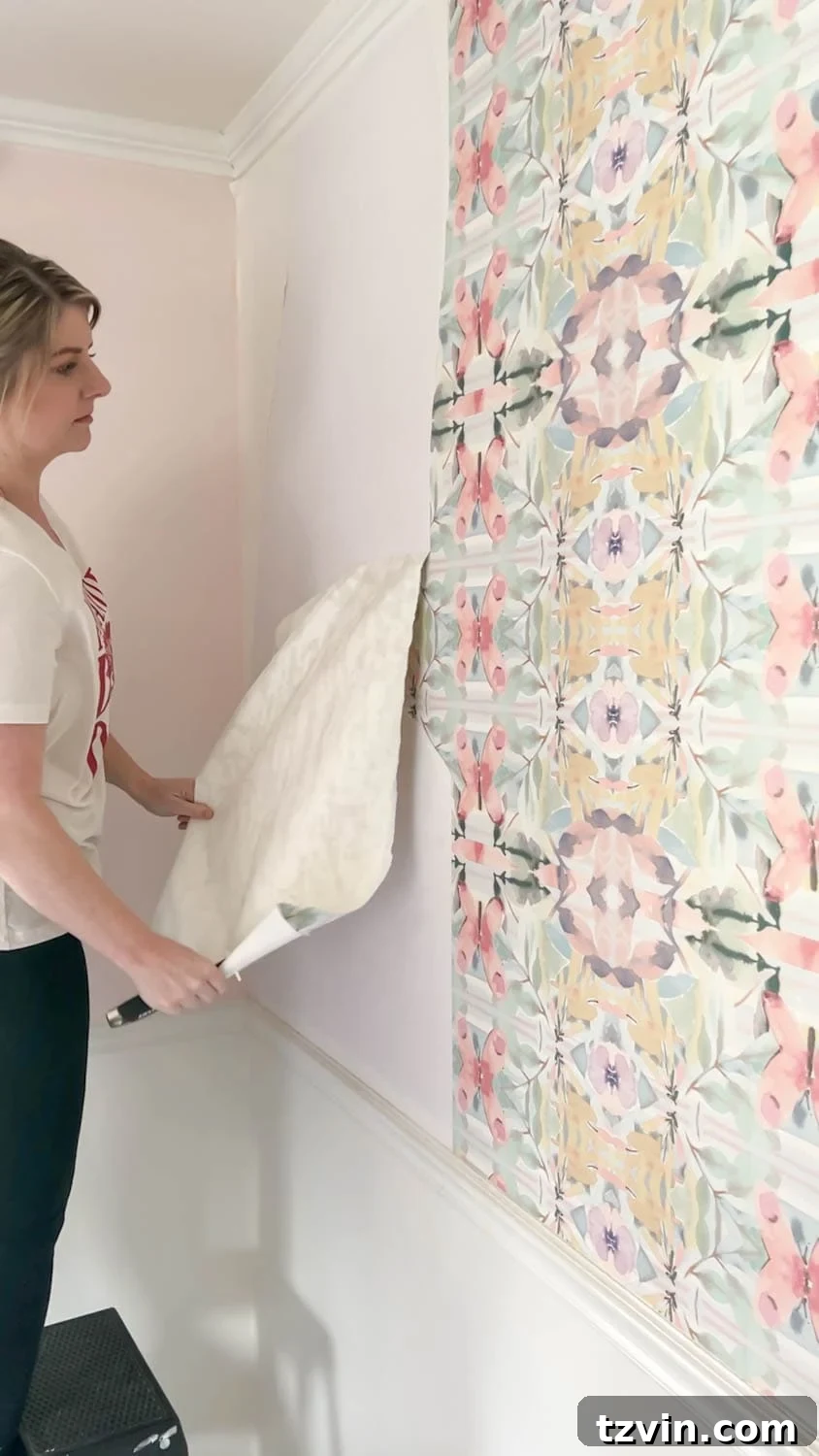 Removing wallpaper effortlessly with store-bought Piranha brand wallpaper stripper