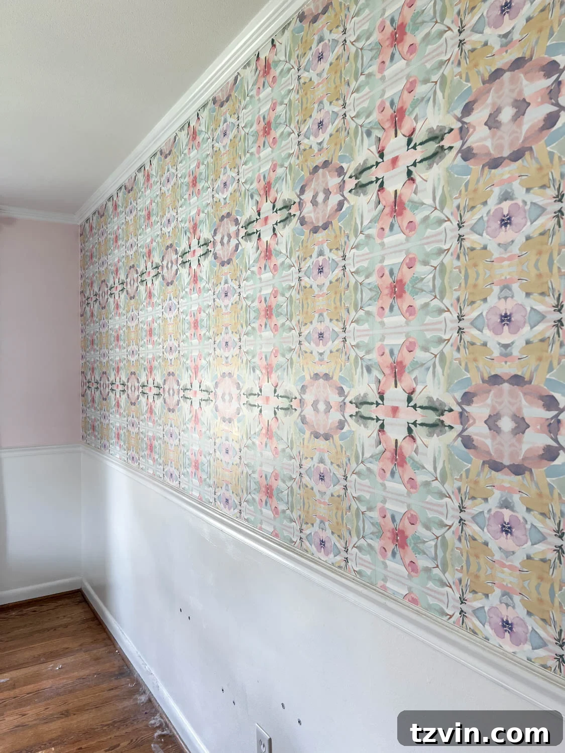 Pasted wallpaper on a wall in a bedroom, ready for removal