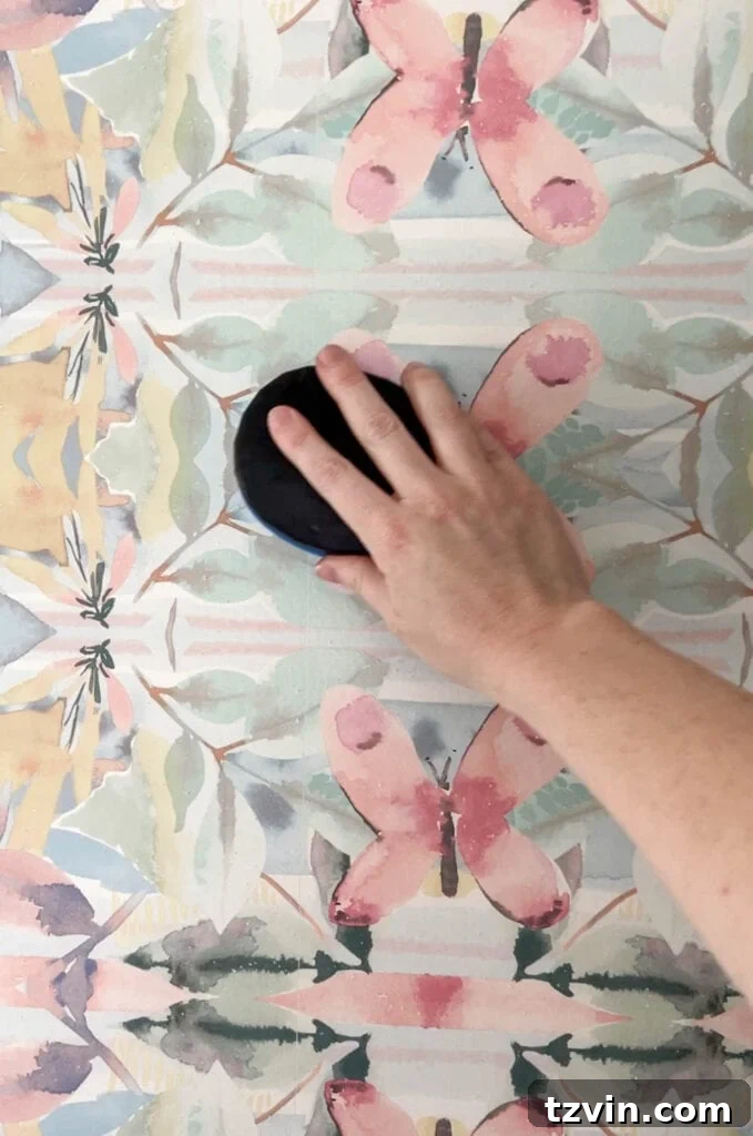 Scoring wallpaper with a specialized tool for easier removal