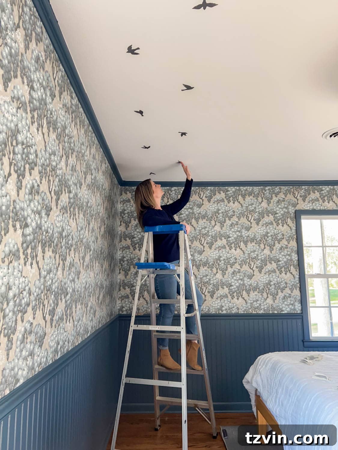 Craft Faux Block Print Ceilings Using Vinyl Decals 3 Applying bird decals in a block print pattern to create fake ceiling wallpaper, demonstrating the DIY installation process.