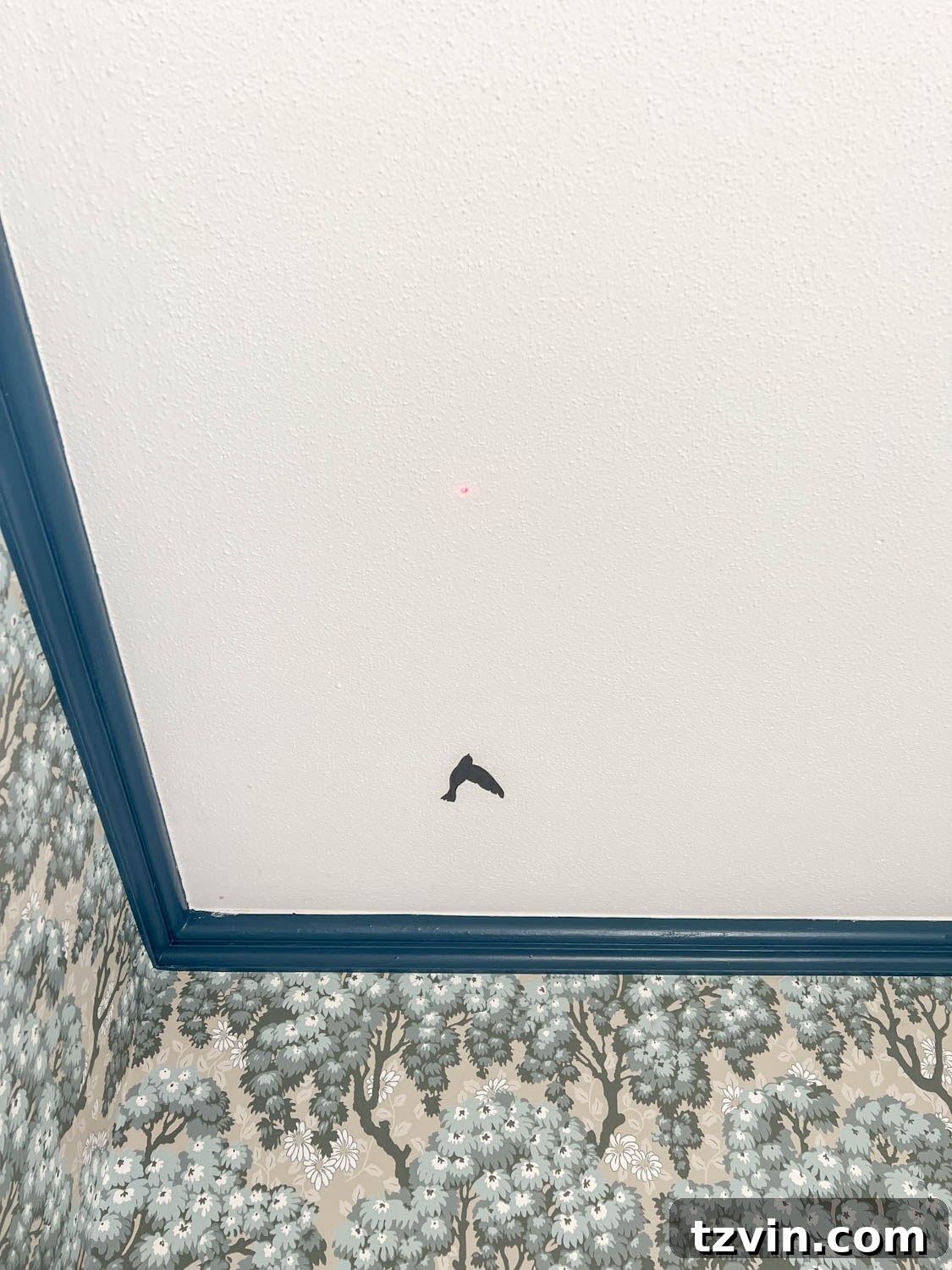 Craft Faux Block Print Ceilings Using Vinyl Decals 8 A bird vinyl decal stuck to a textured ceiling in a block print pattern, guided by a laser marker.
