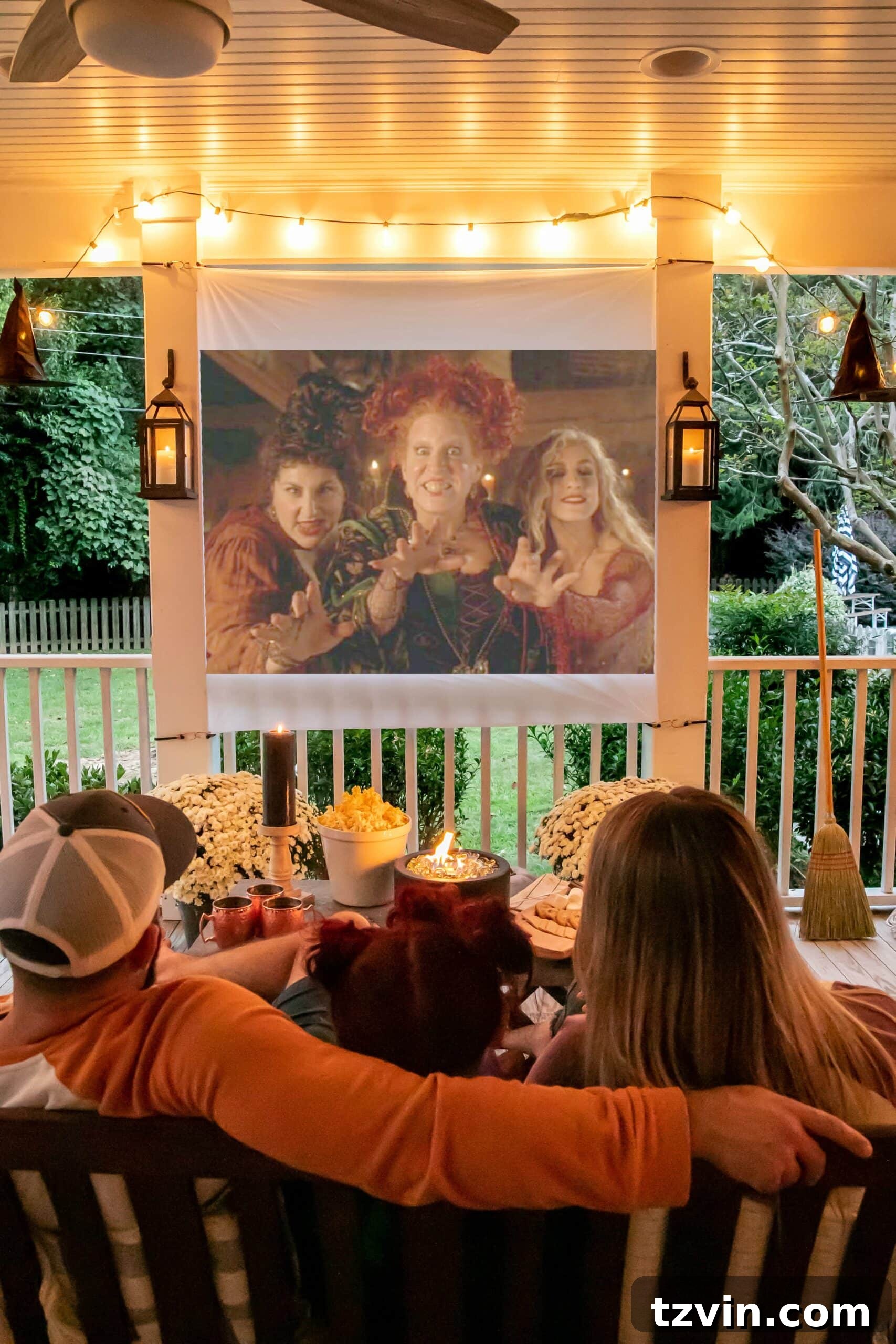 outdoor movie on back porch with fall decor