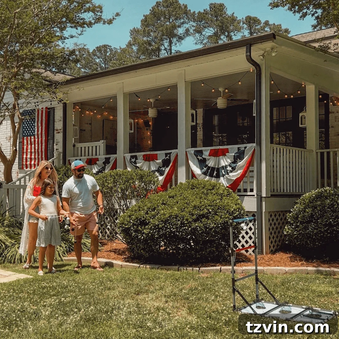 family playing lawn games in the backyard with July 4th decor