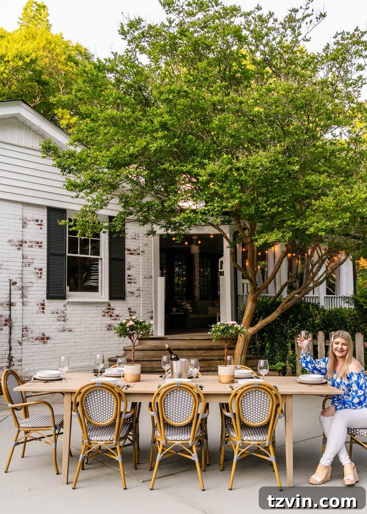 outdoor dining table painted like driftwood on a patio