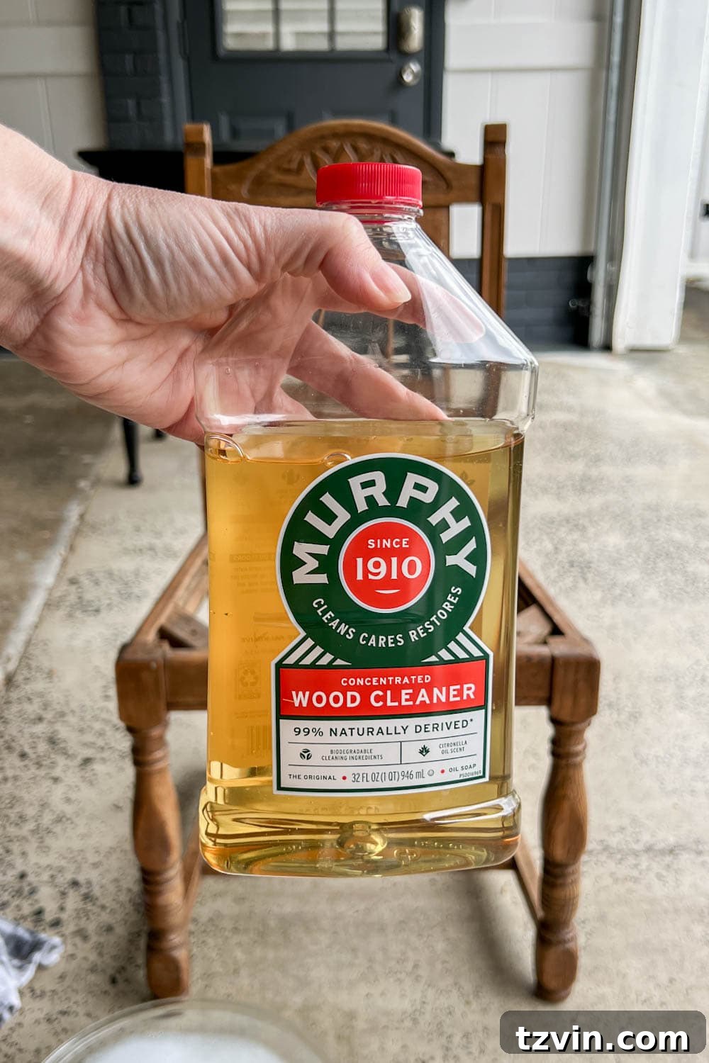 Desk Chair Revival: No-Strip Wood Refinishing 5 Cleaning vintage wood furniture with Murphy Oil Soap, showing the removal of dirt and grime.