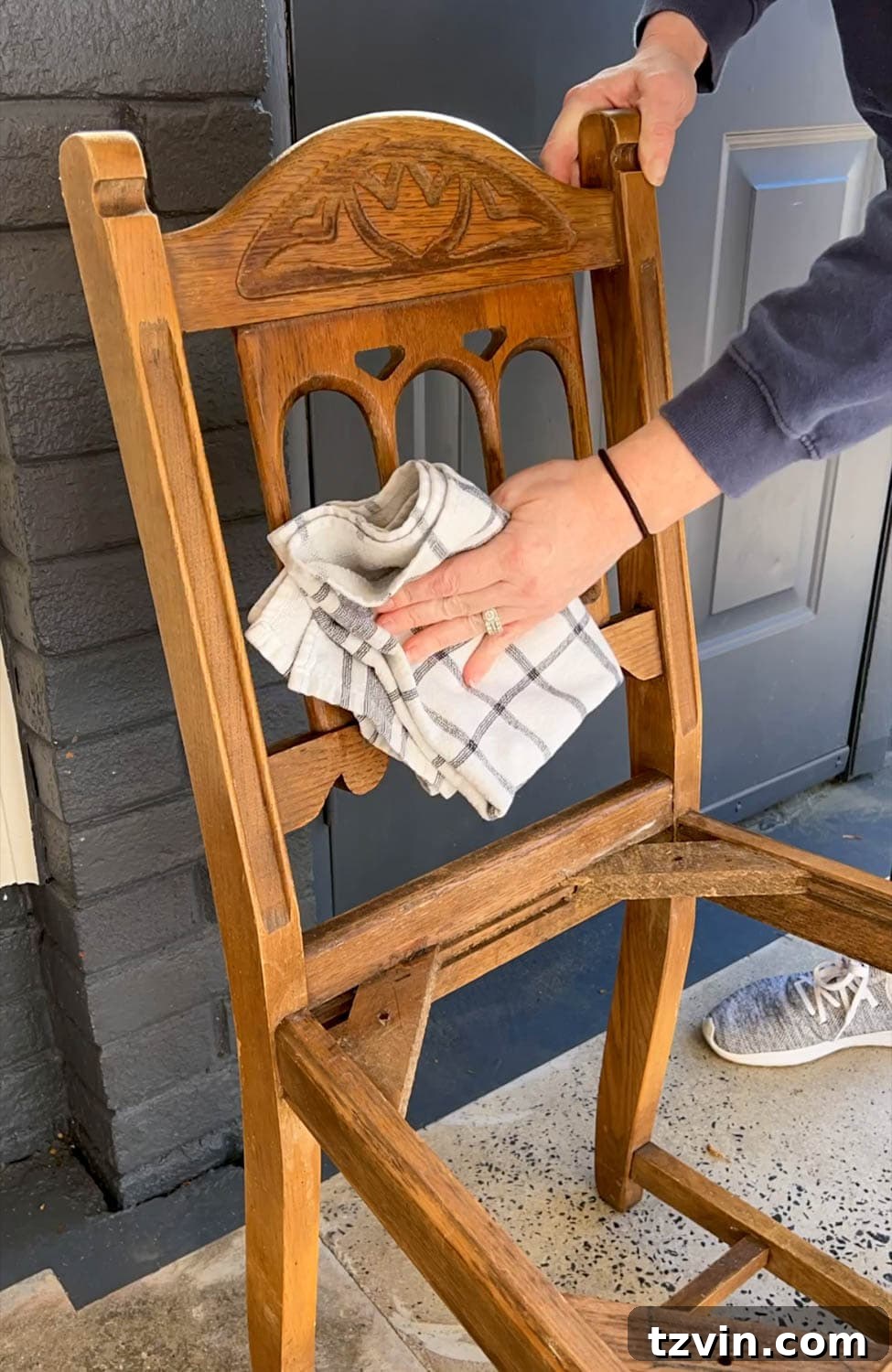 Desk Chair Revival: No-Strip Wood Refinishing 7 Detailed shot of wiping on Restor-A-Finish to restore wood furniture, highlighting the product's effectiveness without stripping.
