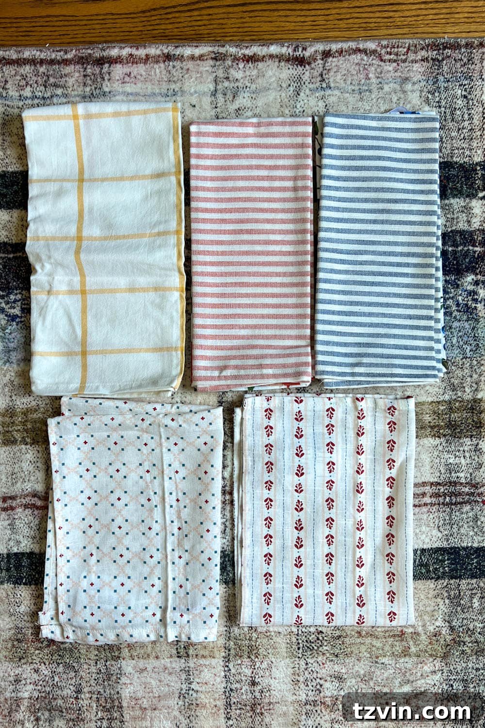 Desk Chair Revival: No-Strip Wood Refinishing 10 Selection of kitchen towels considered for chair seat upholstery, showcasing various patterns and colors.