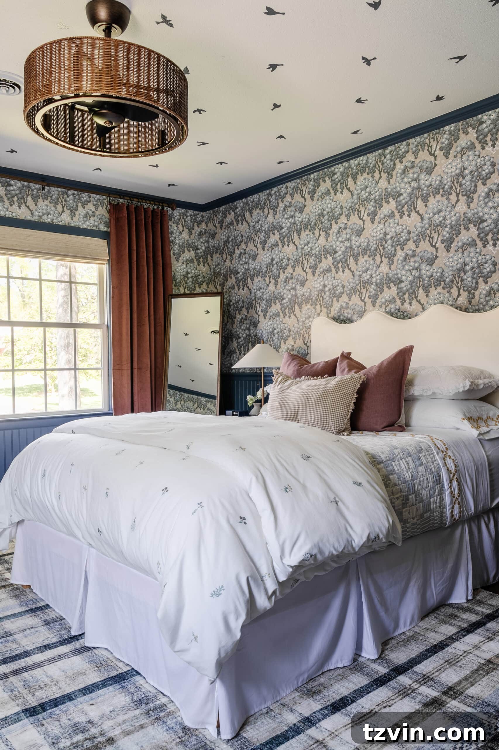 Girls bedroom with pattern play bedding, full length mirror, mauve curtains, and modern lamp
