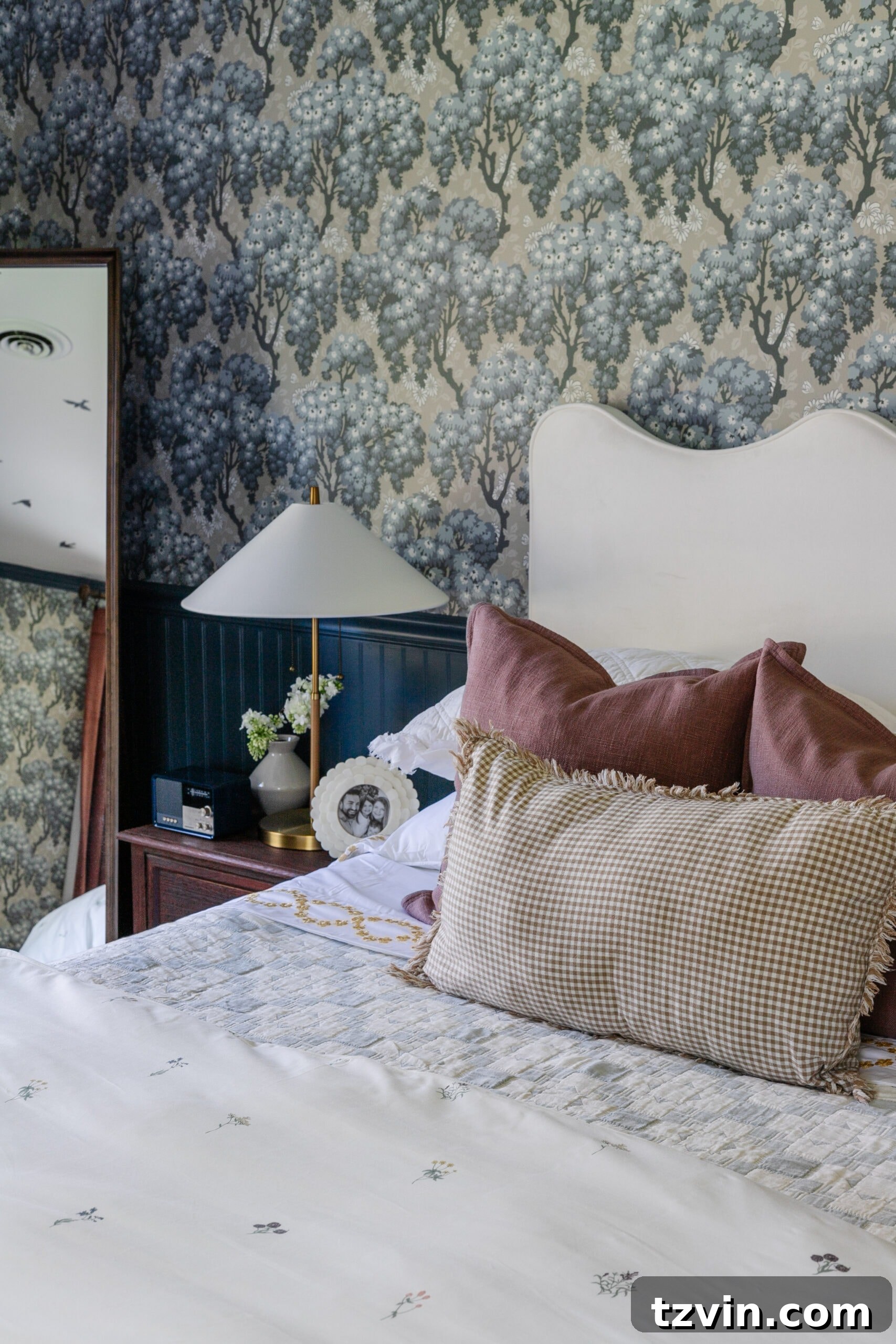 Girls bedroom with pattern play bedding, full length mirror and modern lamp