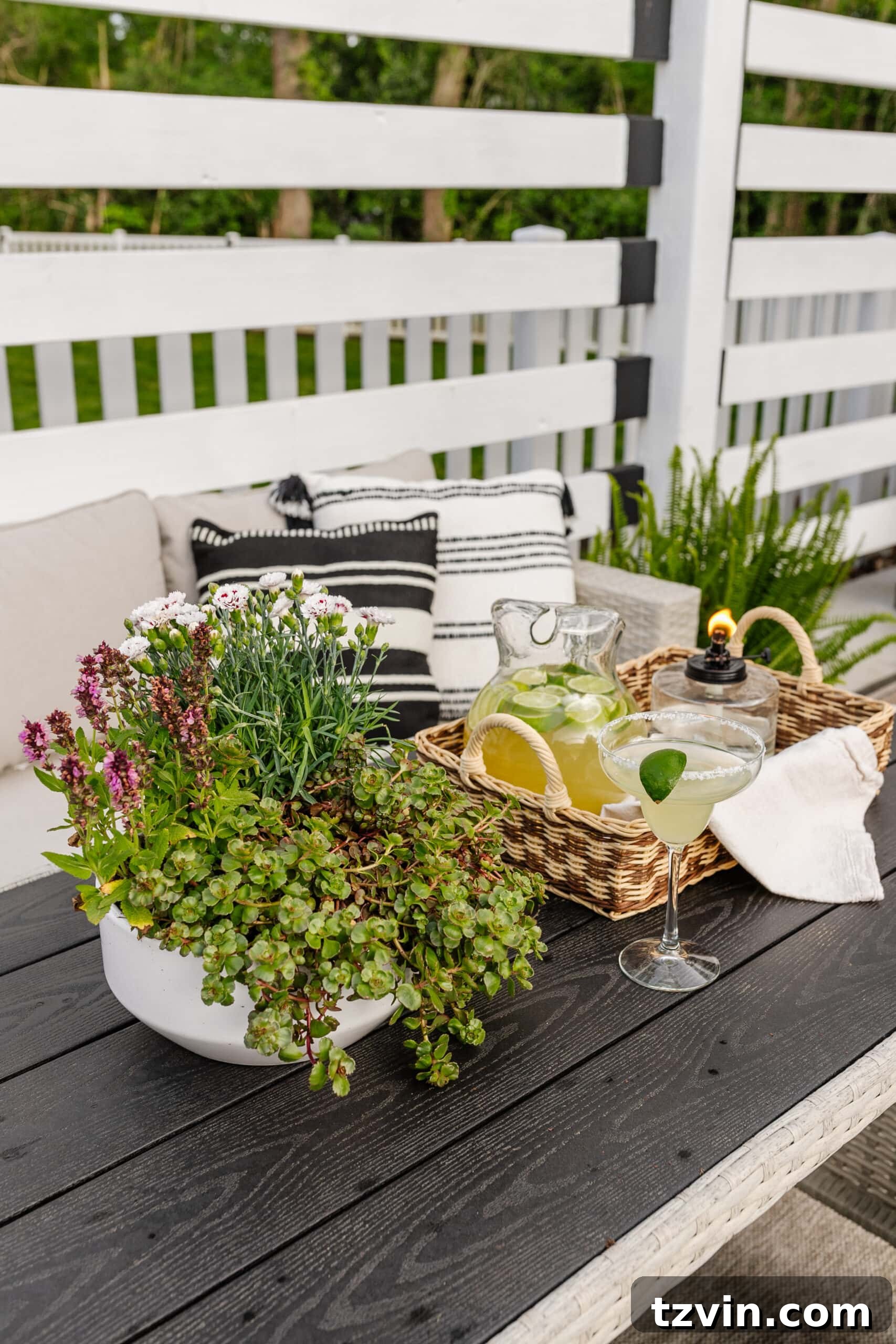 Spring Patio Refresh 17 patio dining table with tray, tabletop tiki torch, margarita pitcher, and potted plant