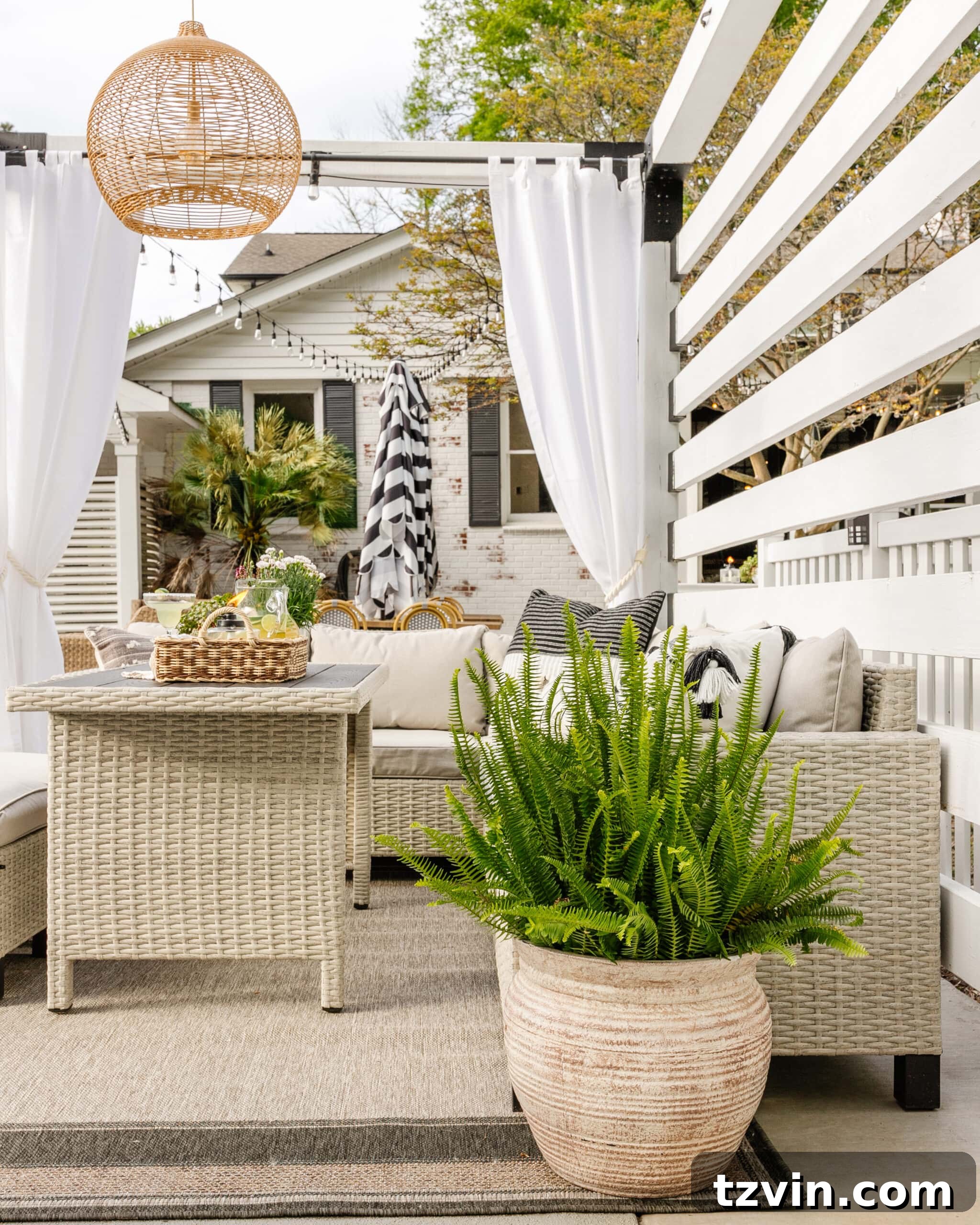 Spring Patio Refresh 18 Walmart patio furniture in a DIY backyard pool cabana pergola with a potted fern