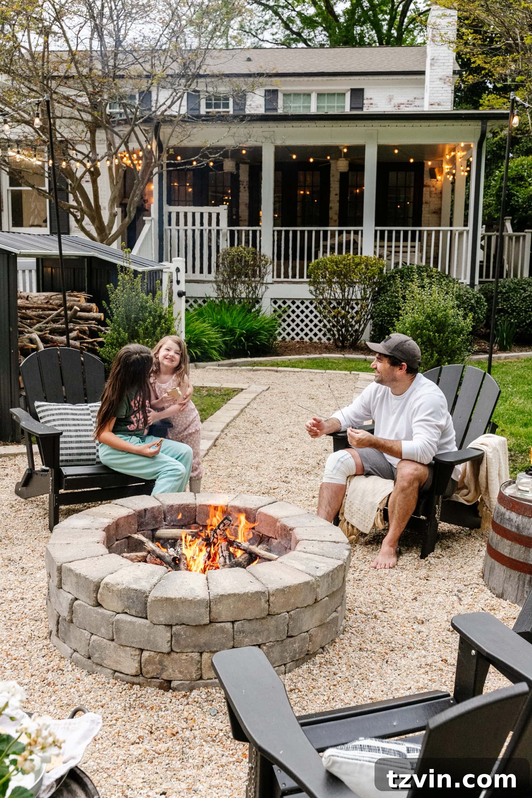 Spring Patio Refresh 27 family sitting around a backyard fire pit
