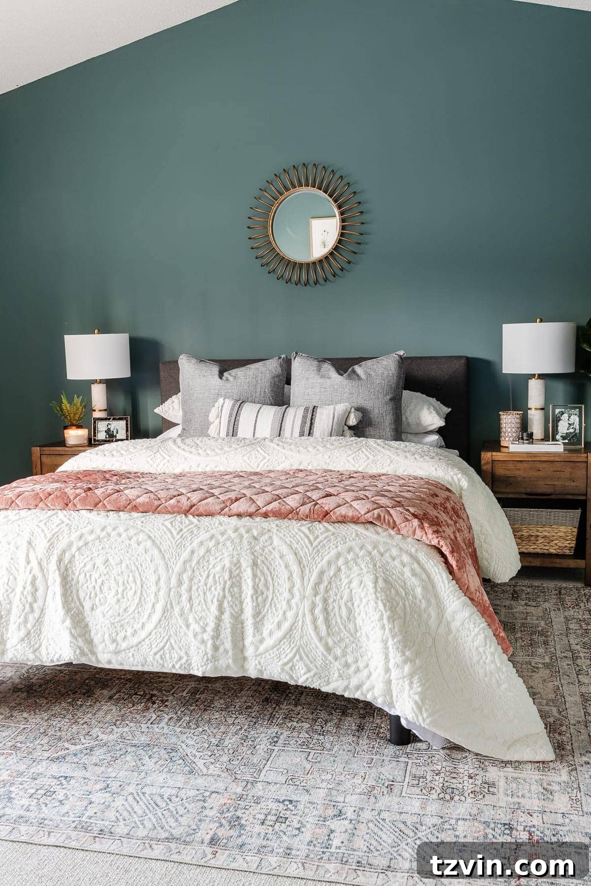 bedroom decorated with teal walls and loloi rug from Chris Loves Julia