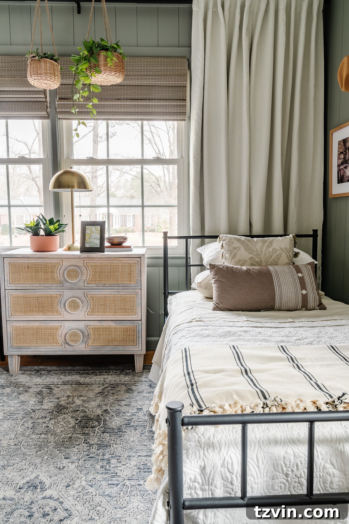 girls shared bedroom makeover with twin beds, sage walls, and loloi rug