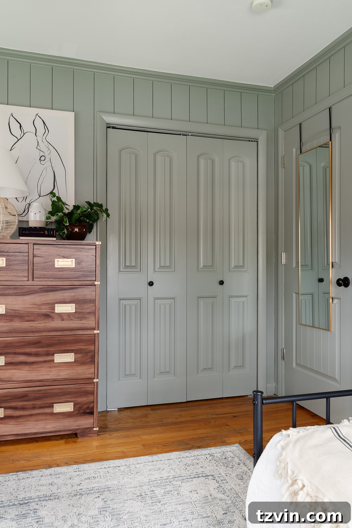 Transforming Kids' Spaces: 24 Brilliant Storage & Decor Solutions 30 doors in a bedroom painted Sherwin Williams Evergreen Fog with full mirror hanging on the back