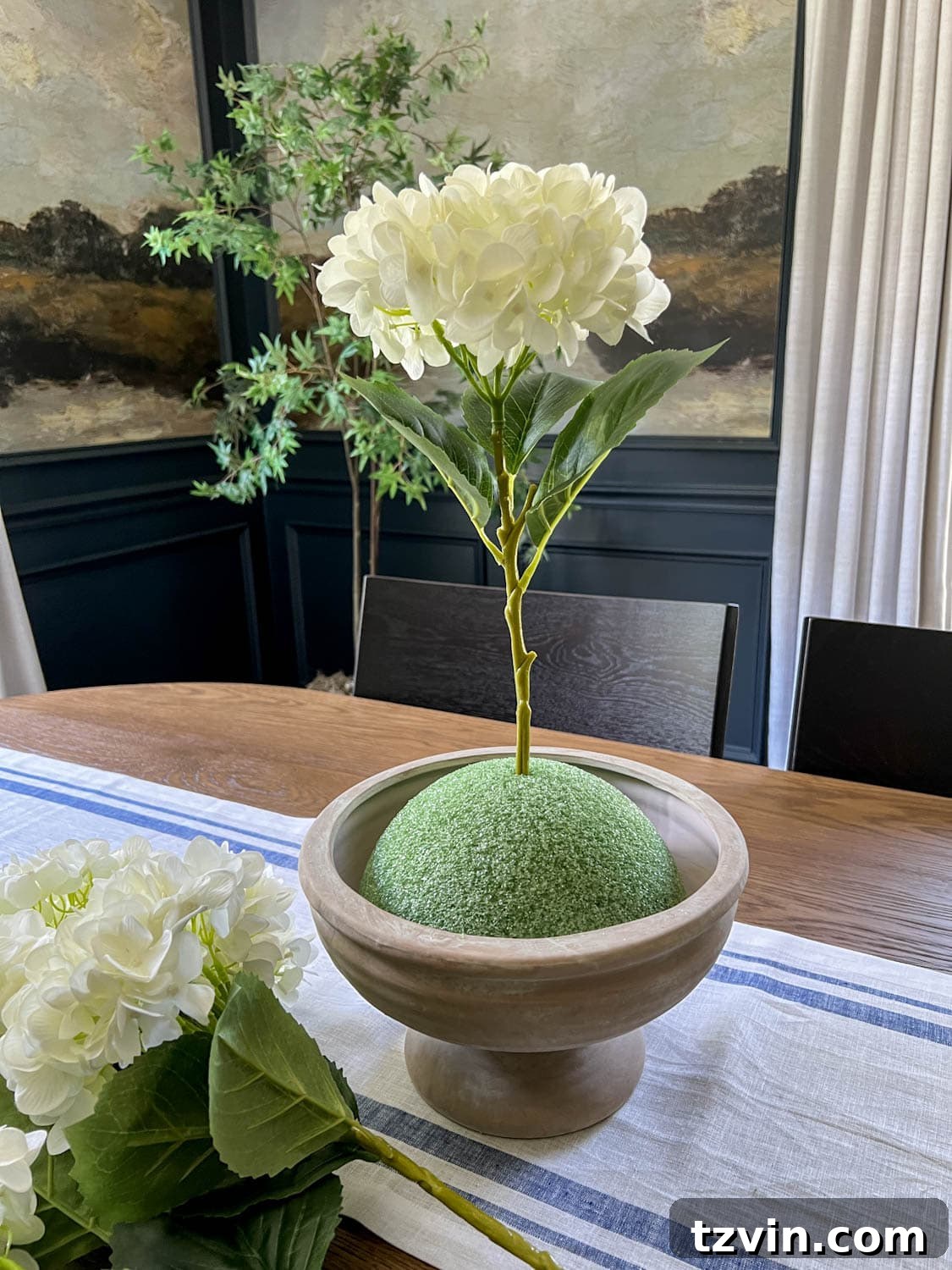 faux flower placed in florist foam 