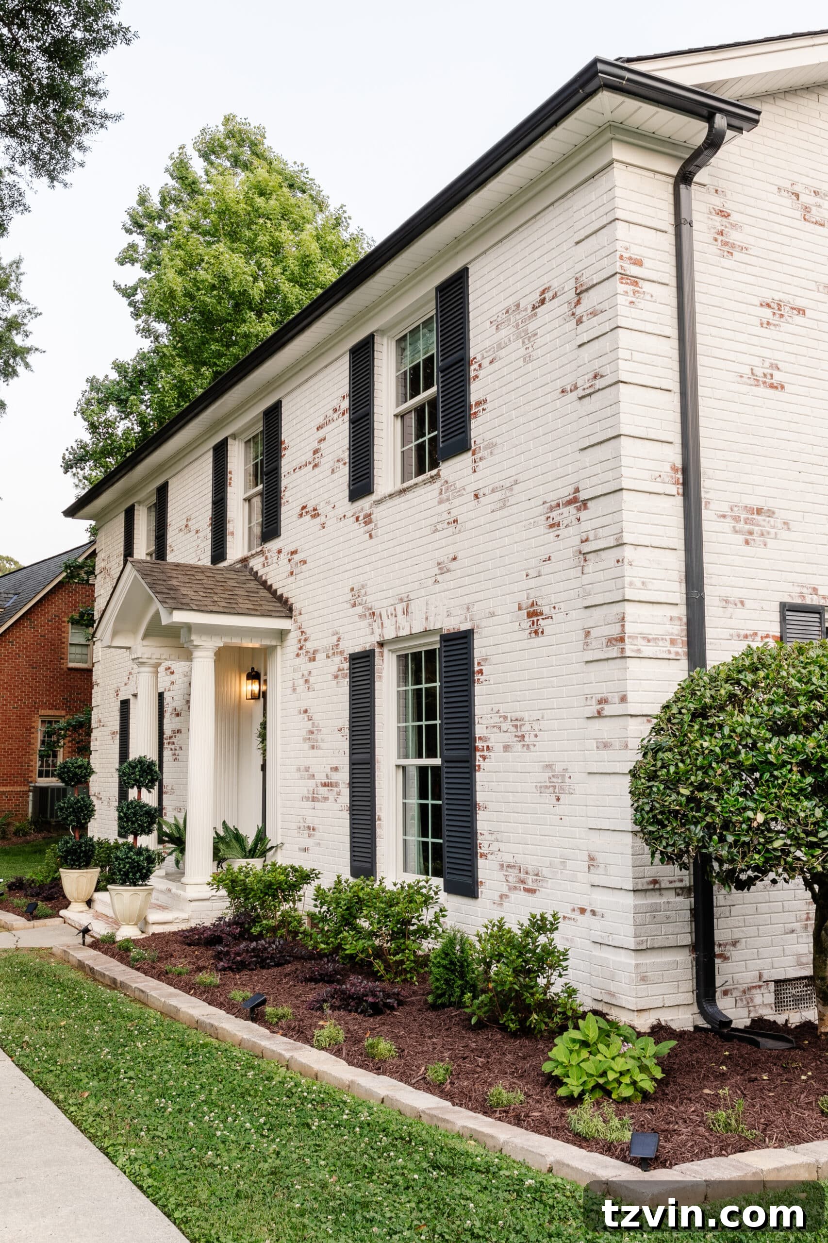 Mastering Limewashed Brick Cleaning and Upkeep 17 limewashed brick colonial house and flower beds