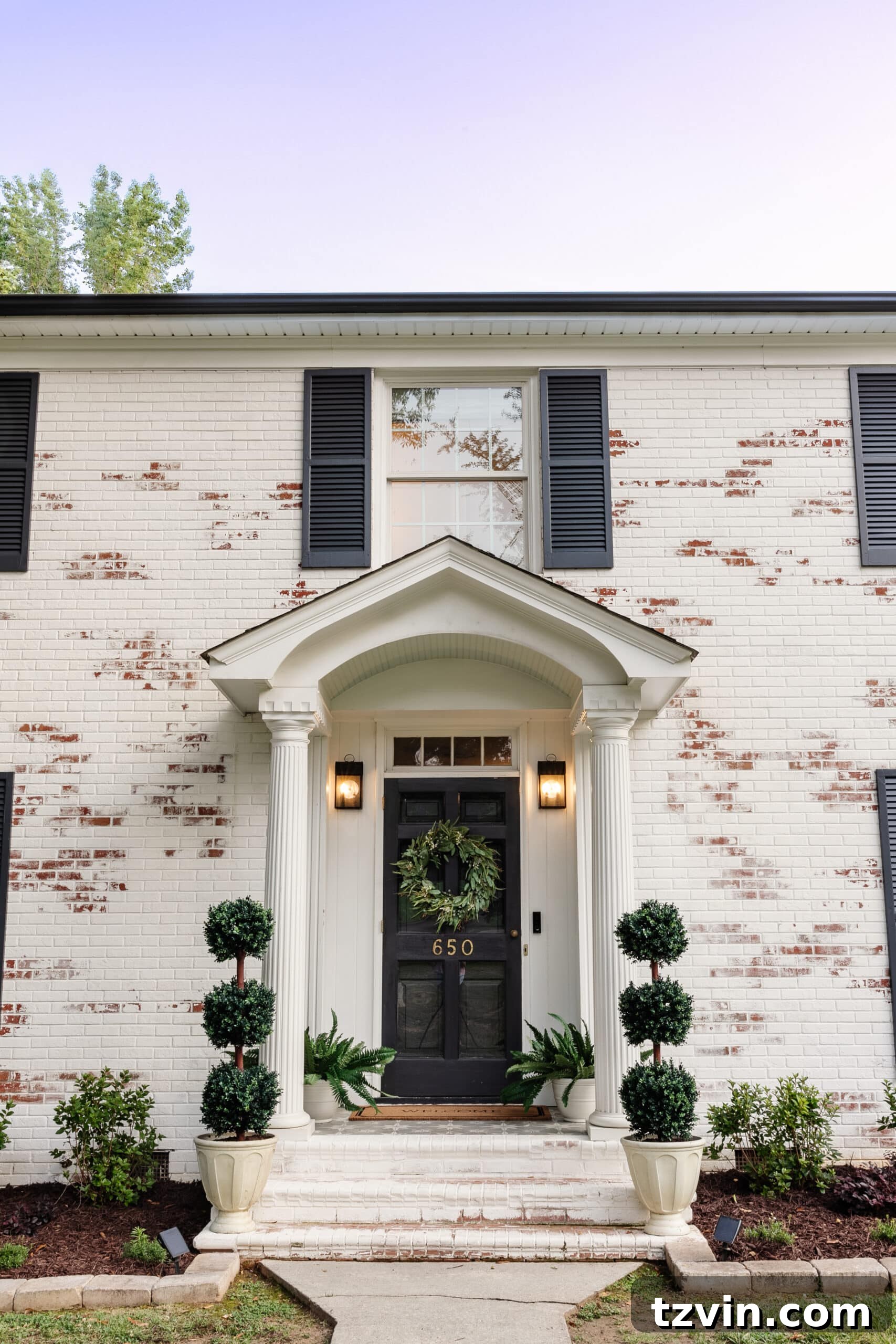 Mastering Limewashed Brick Cleaning and Upkeep 5 front porch stoop on a colonial house with topiaries, ferns, and wreath