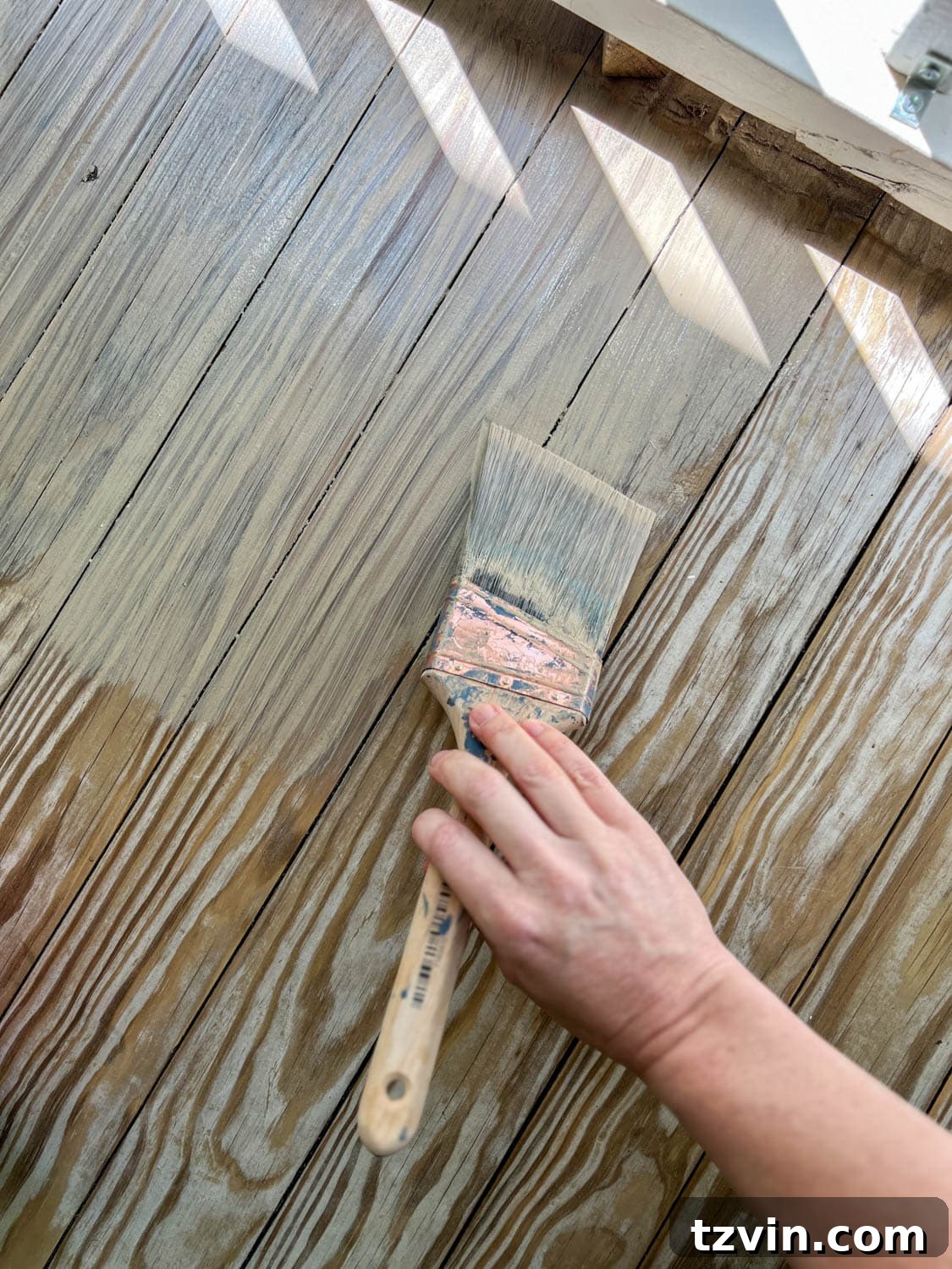 Finding Your Perfect Neutral Driftwood Deck Stain 7 applying Behr Taupe stain to remove yellow tone from wood deck