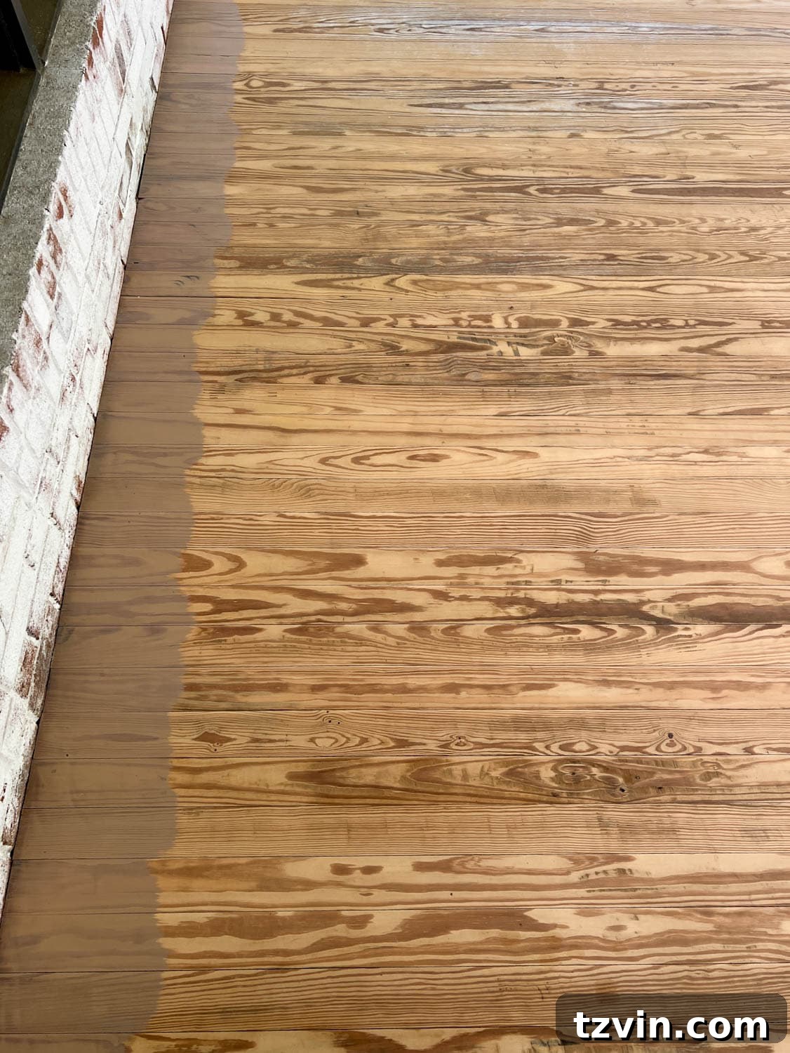 Finding Your Perfect Neutral Driftwood Deck Stain 9 brushing Behr Taupe stain on old deck wood near brick wall