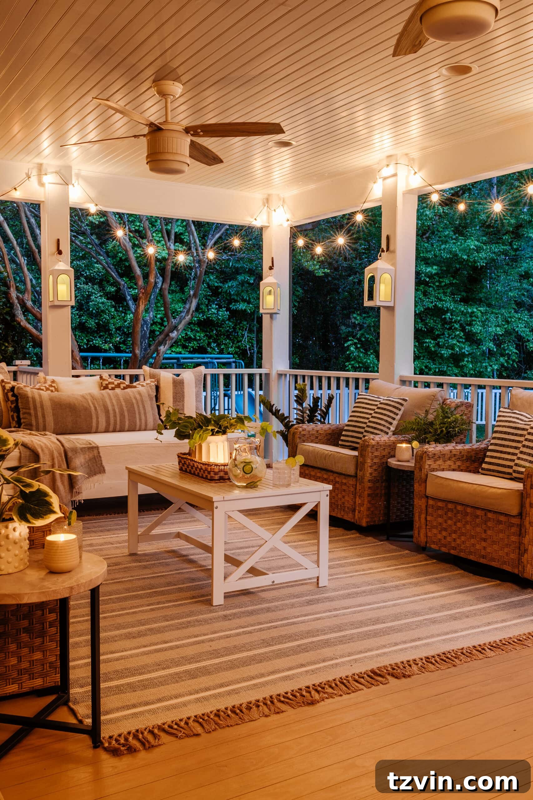 back porch conversation set with string lights and lanterns at night