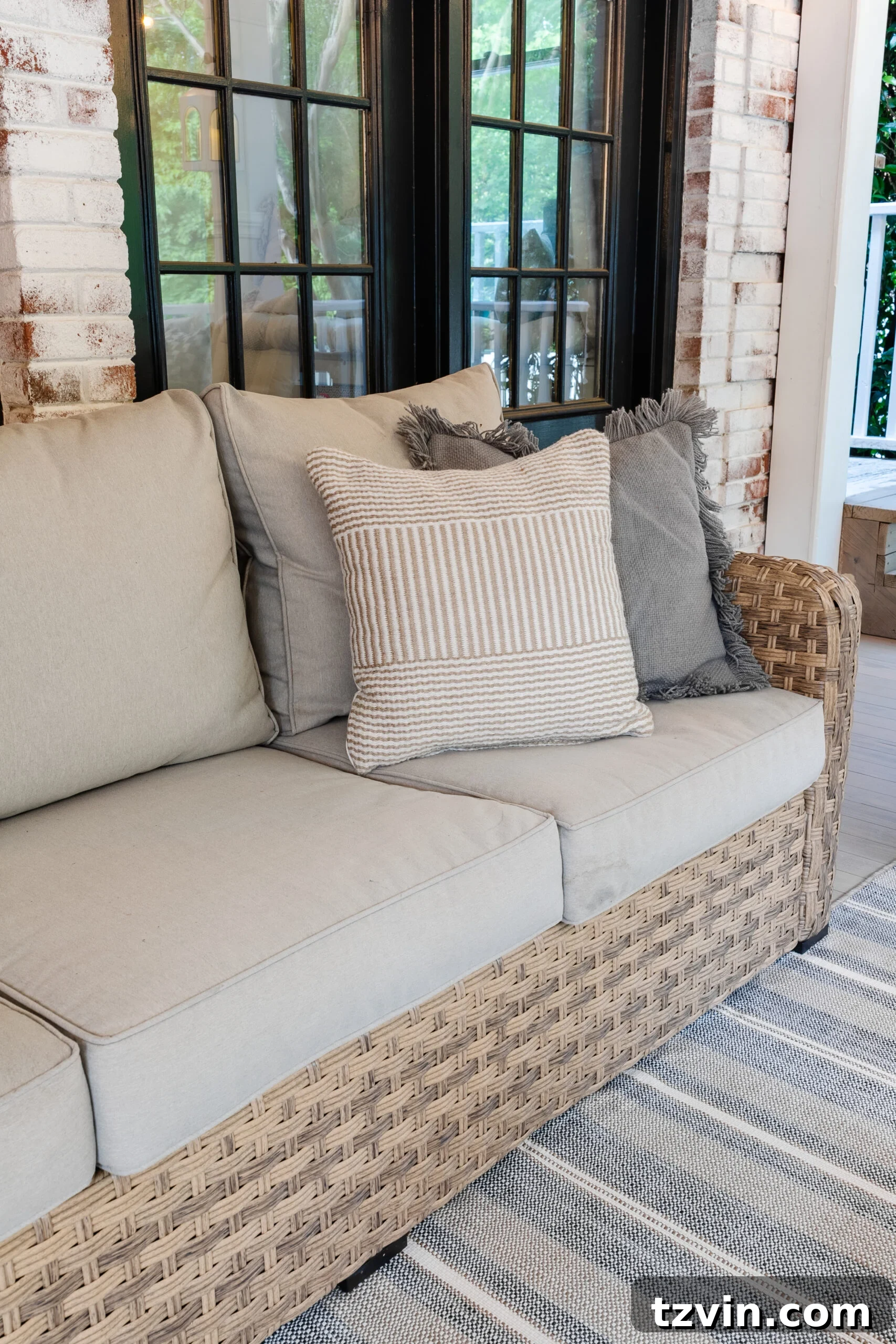 wicker outdoor sofa on a back porch