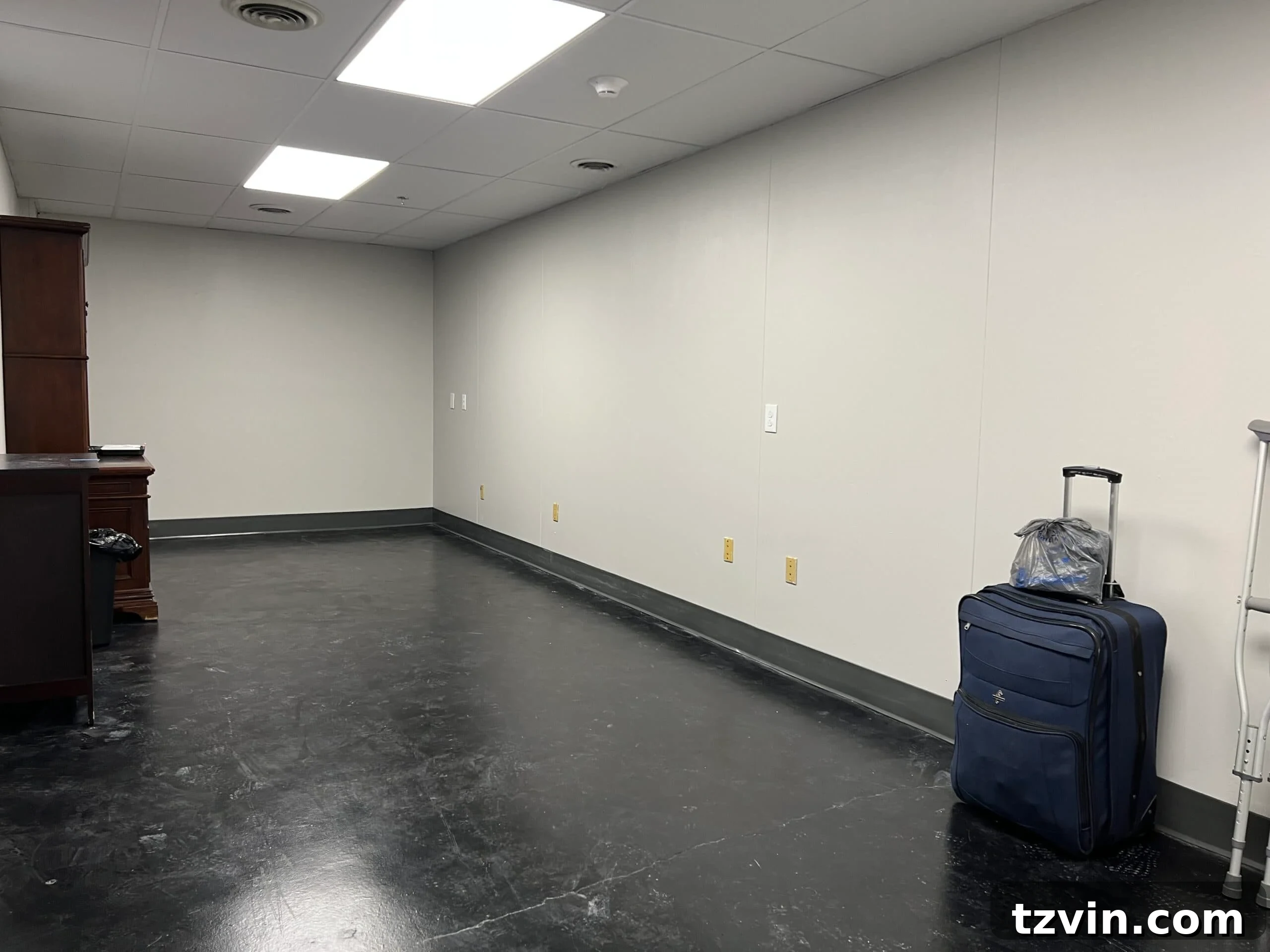 Inspiring Collaboration: Conference Room Mood Board Designs 6 A different perspective of the conference room before renovation, emphasizing the bare walls and minimal decor