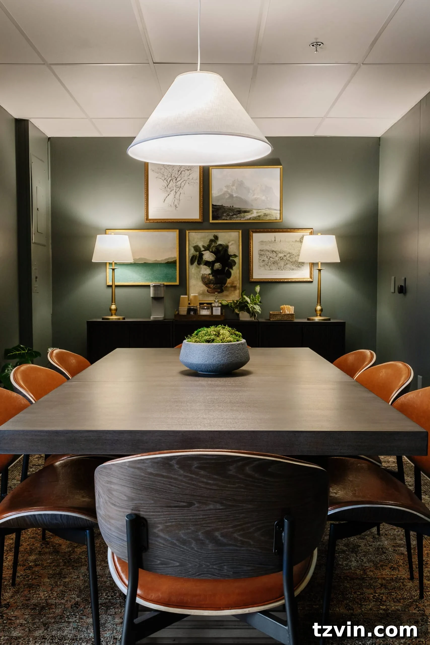 Warm Up Your Workday Cozy Conference Room Ideas for an Office Refresh 12 Cozy conference room setup with a large table and chairs, illuminated by soft lamps instead of harsh fluorescent lights, creating a warm, inviting atmosphere.