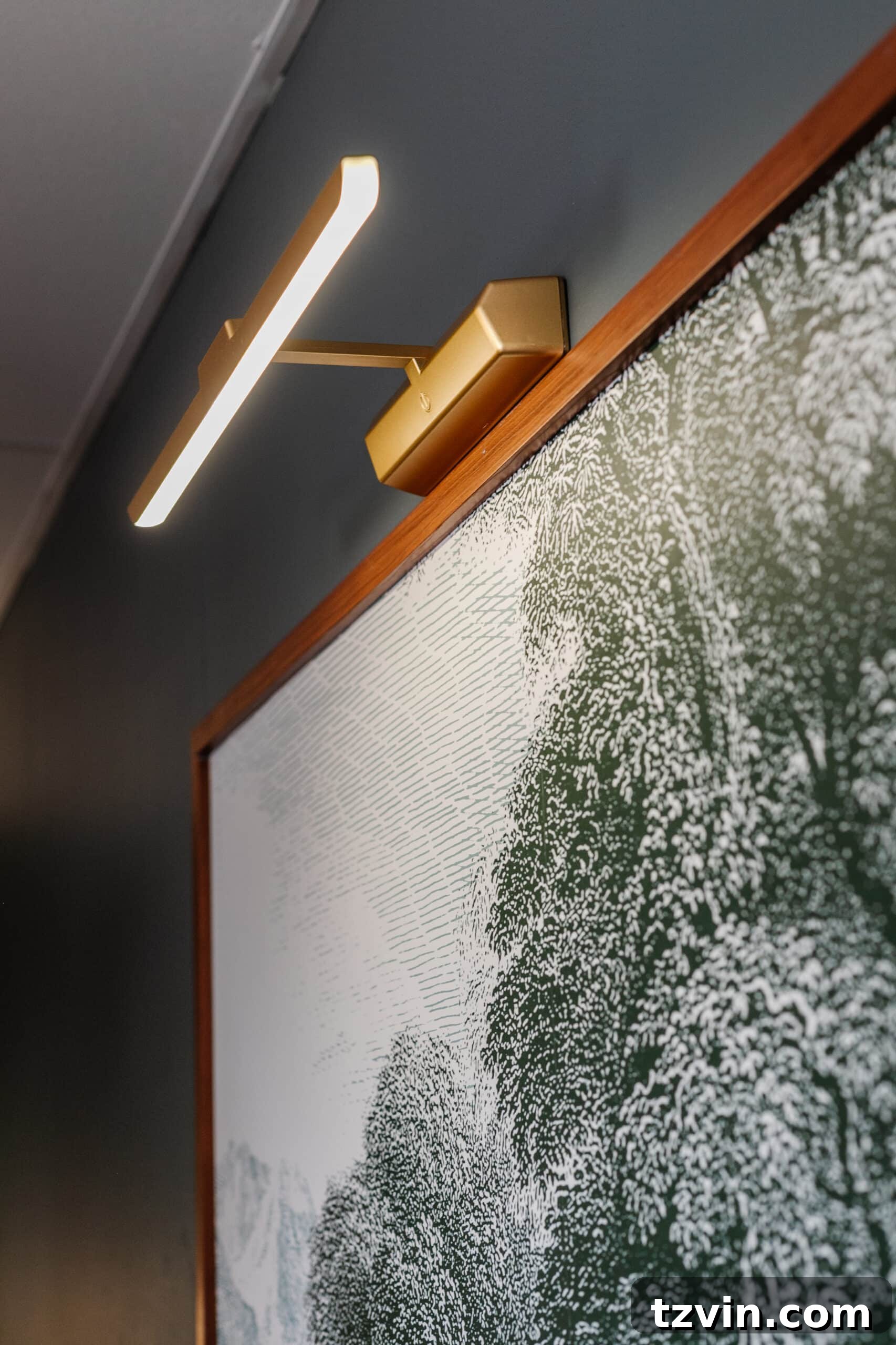 Warm Up Your Workday Cozy Conference Room Ideas for an Office Refresh 16 A creative memo board disguised as framed art, illuminated by wireless picture lights, blending functionality with aesthetic appeal.