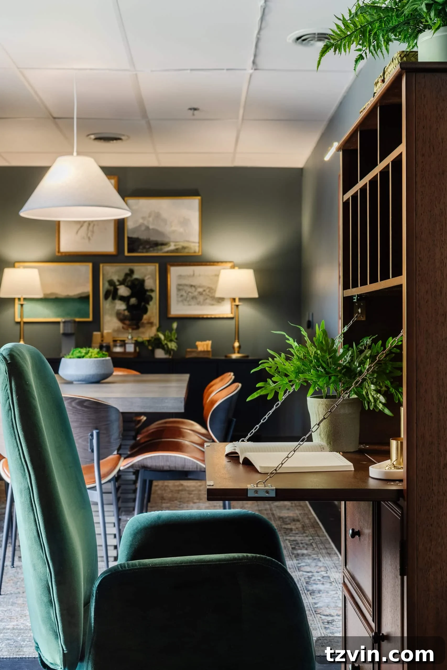 Warm Up Your Workday Cozy Conference Room Ideas for an Office Refresh 25 Open wooden secretary desk revealing organized storage compartments, beside a comfortable green desk chair, optimized for office use.