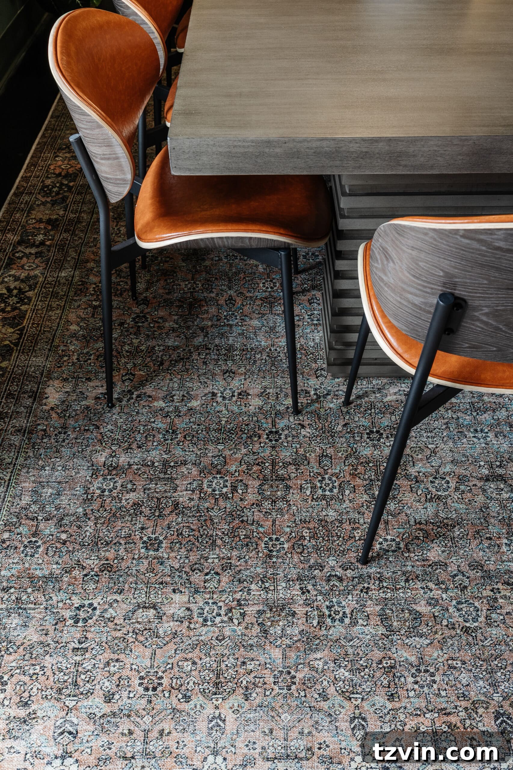 Warm Up Your Workday Cozy Conference Room Ideas for an Office Refresh 28 A vibrant terracotta, teal, and moss green rug defining the central area of a conference room, adding warmth and color.
