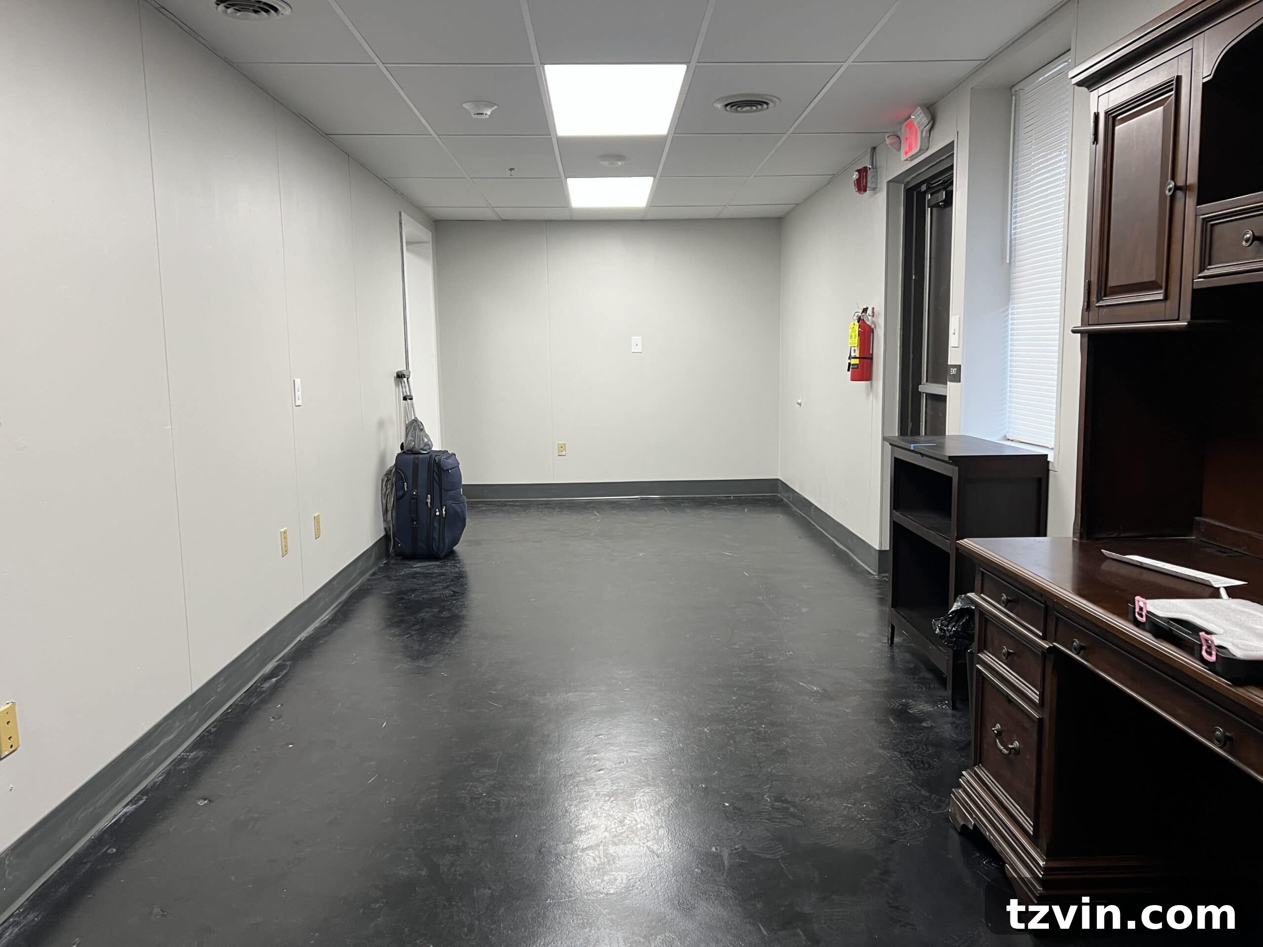 Warm Up Your Workday Cozy Conference Room Ideas for an Office Refresh 6 Before view of a dull and uninspiring conference room, highlighting the potential for dramatic transformation.