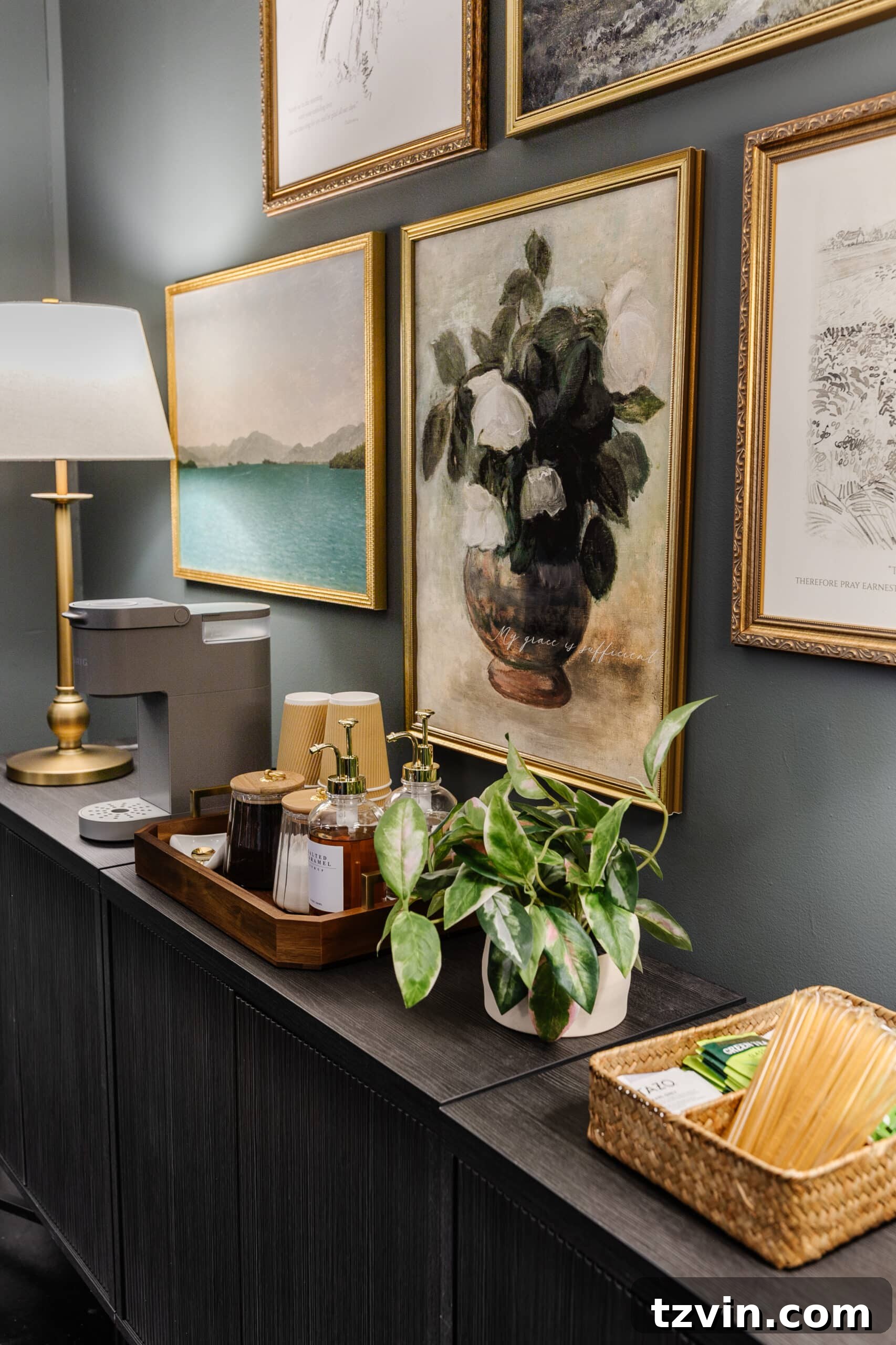 Warm Up Your Workday Cozy Conference Room Ideas for an Office Refresh 8 A well-appointed coffee station on a sideboard in a conference room, complemented by a gallery wall, inviting guests to relax.
