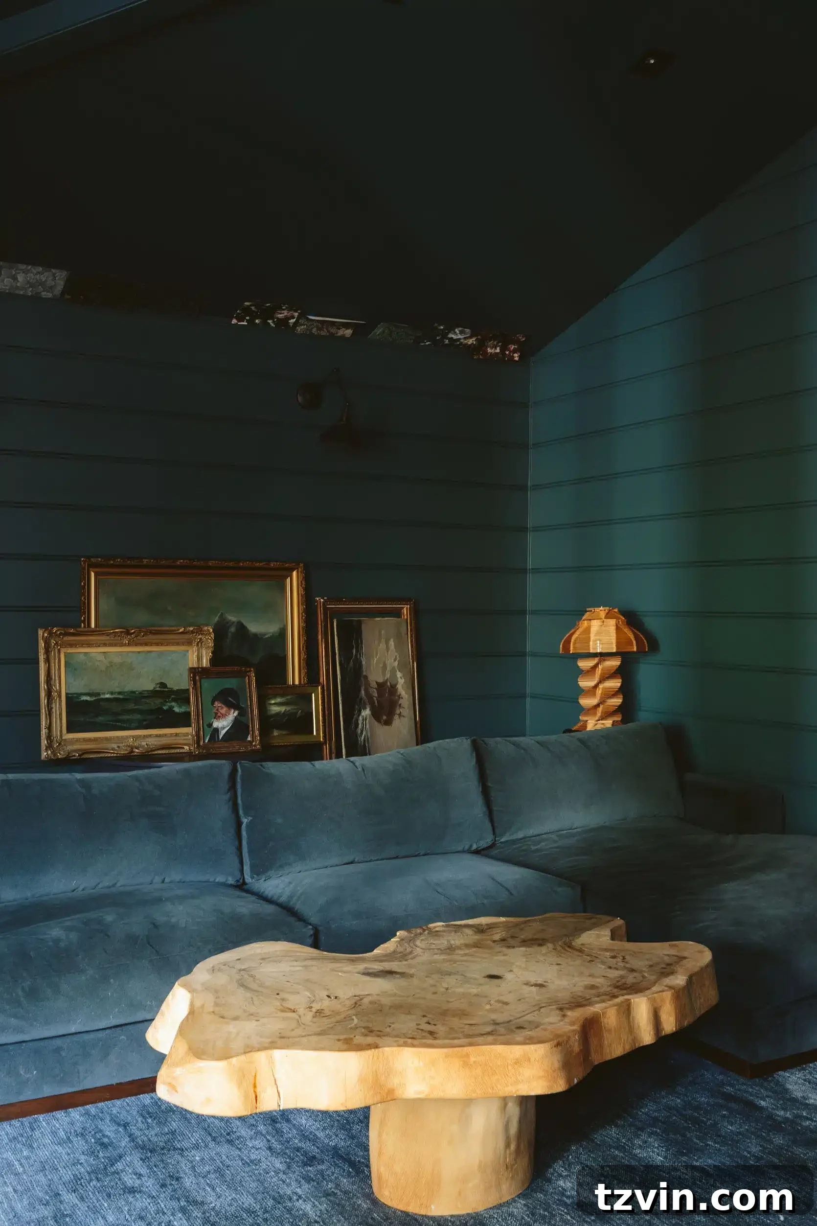 sherwin williams still water dark teal on shiplap wall in a family room - a serene and muted teal, reflecting tranquil natural environments.