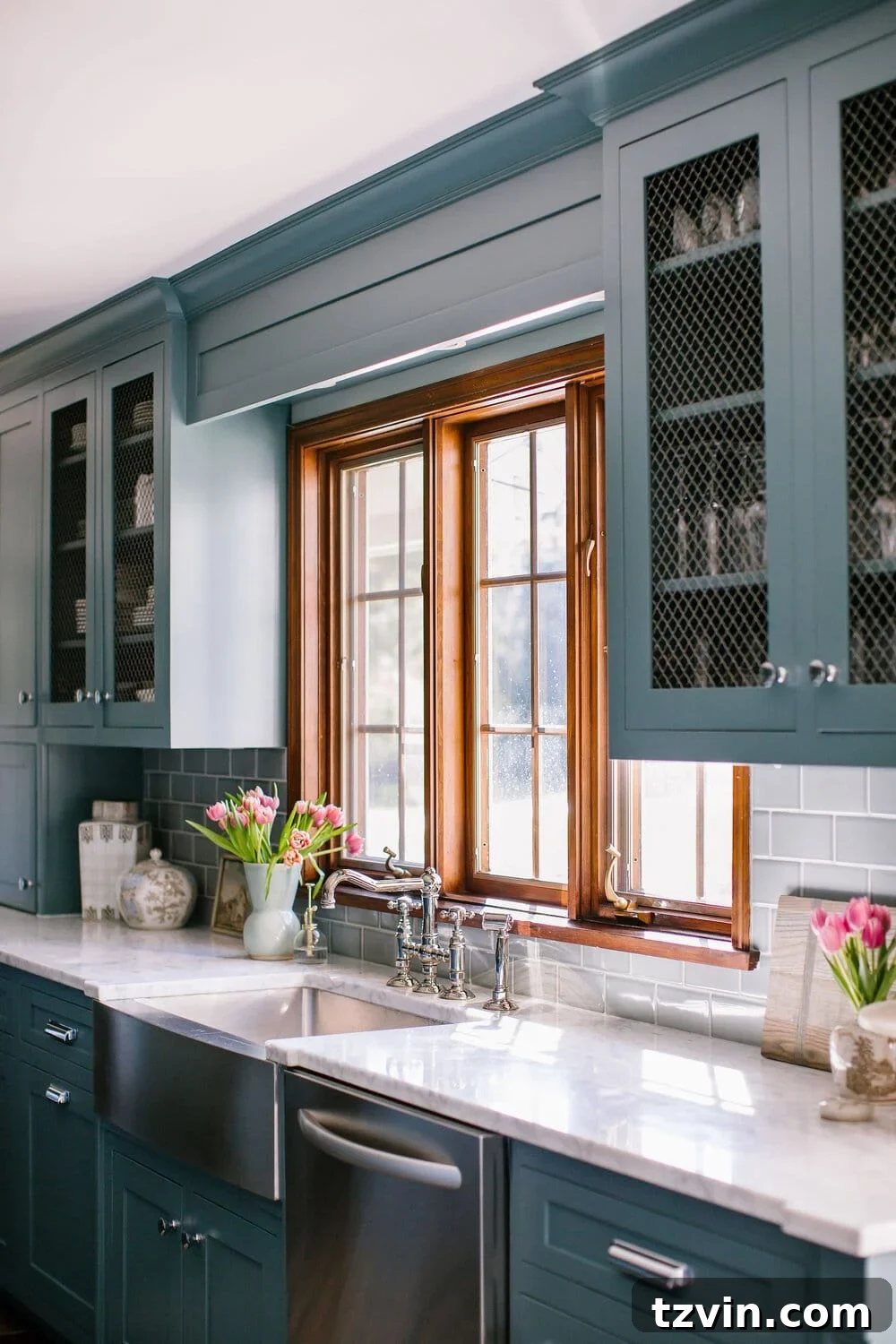 Sherwin Williams Tempe Star dark teal blue cabinets in a kitchen - a deep, saturated teal with strong blue characteristics.
