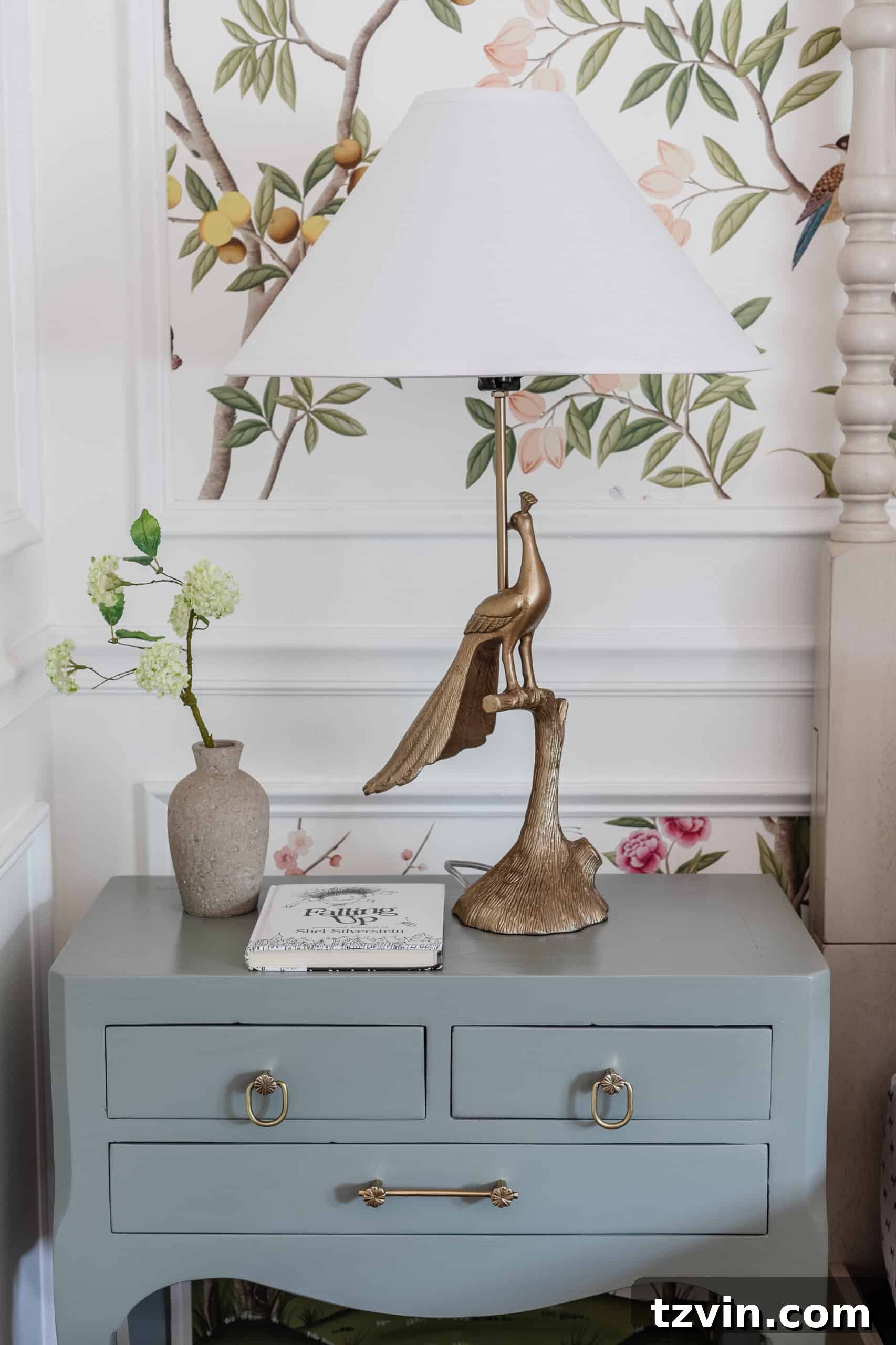 peacock table lamp on a girl's nightstand