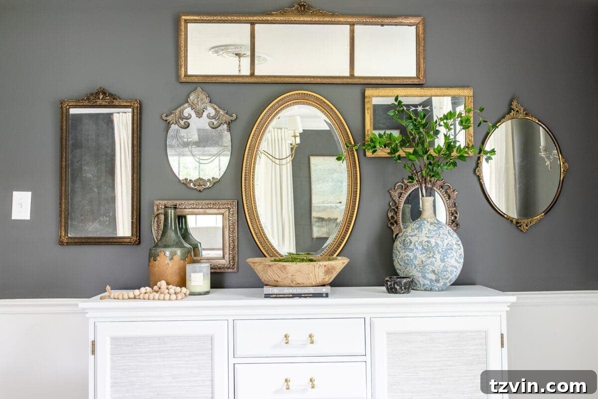 Hang Frames Perfectly Avoid These Common Errors 11 A beautifully decorated buffet with art arranged above it, showcasing ideal placement.