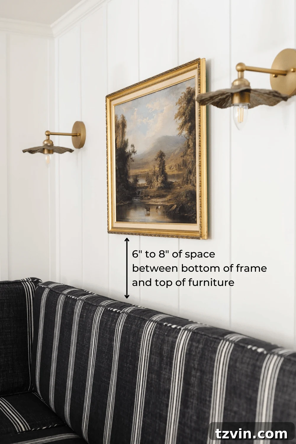Hang Frames Perfectly Avoid These Common Errors 13 Diagram illustrating the correct height to hang a picture over furniture, maintaining a 6-8 inch gap.