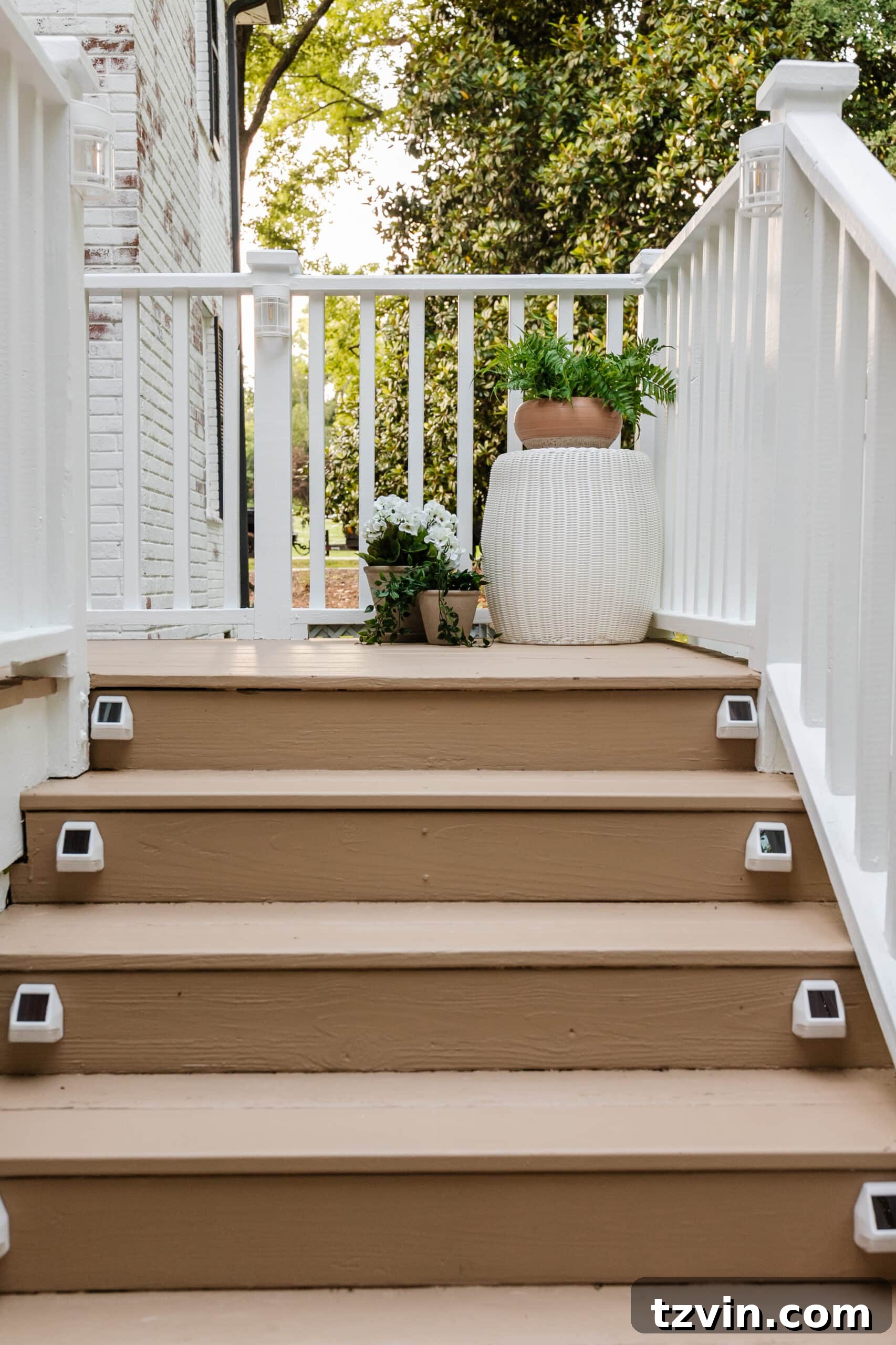deck step solar lights on a deck with planters