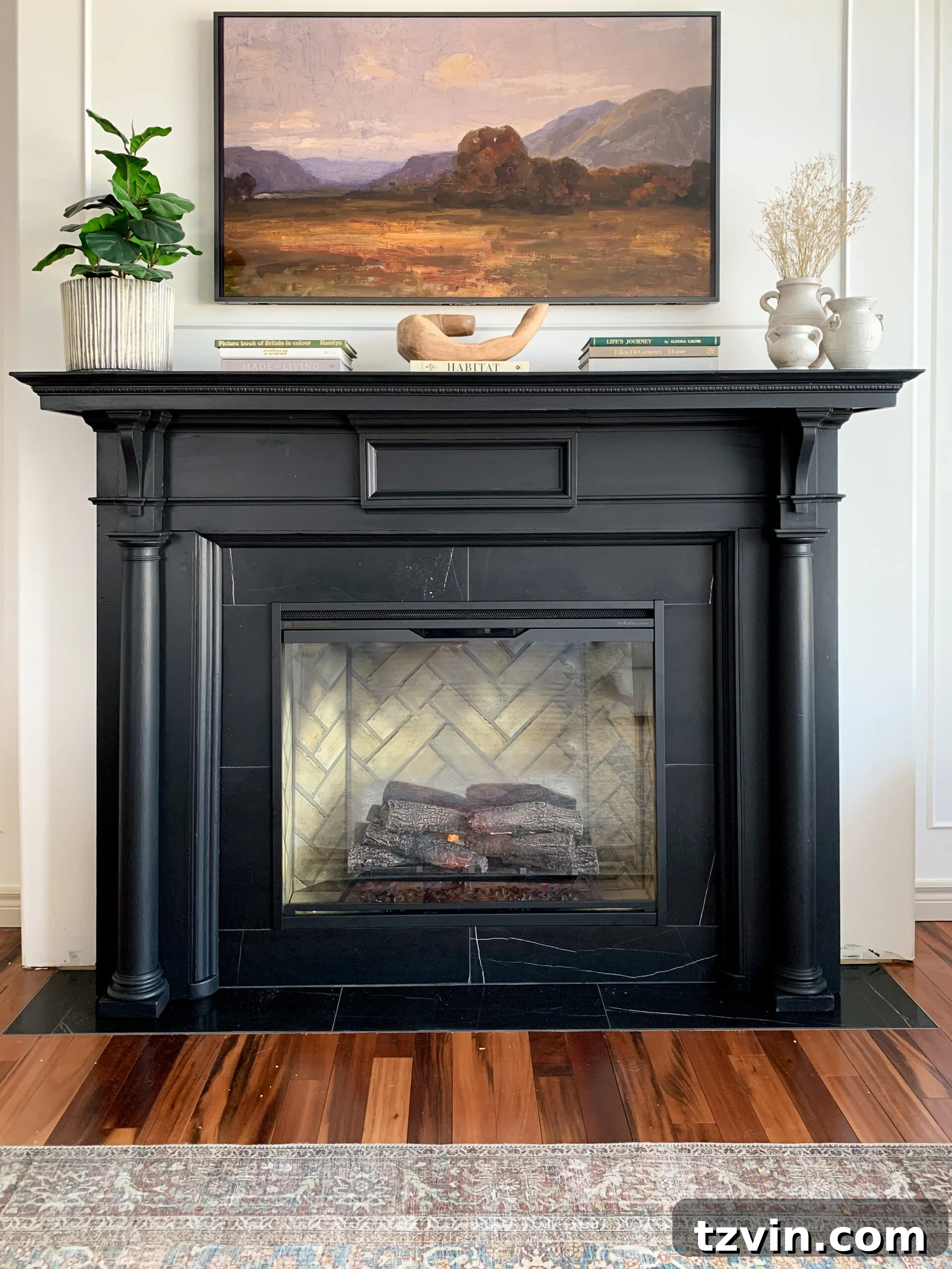 DIY Fireplace Creations for Any Space 12 An electric fireplace elegantly framed by a black marble tile surround and an antique wooden mantel.