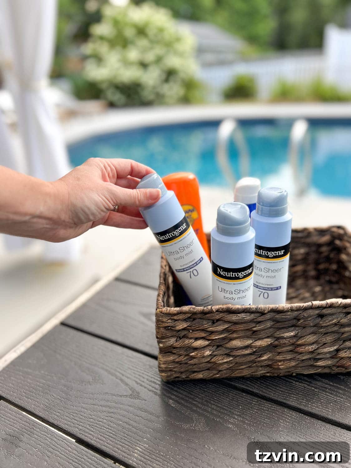 sunscreen basket provided for backyard pool party for guests to use