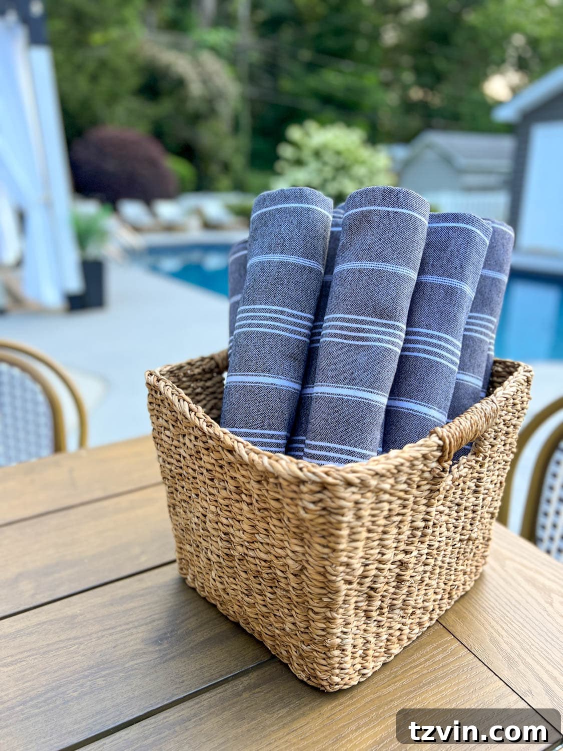 backyard pool towels in a basket for guests to use