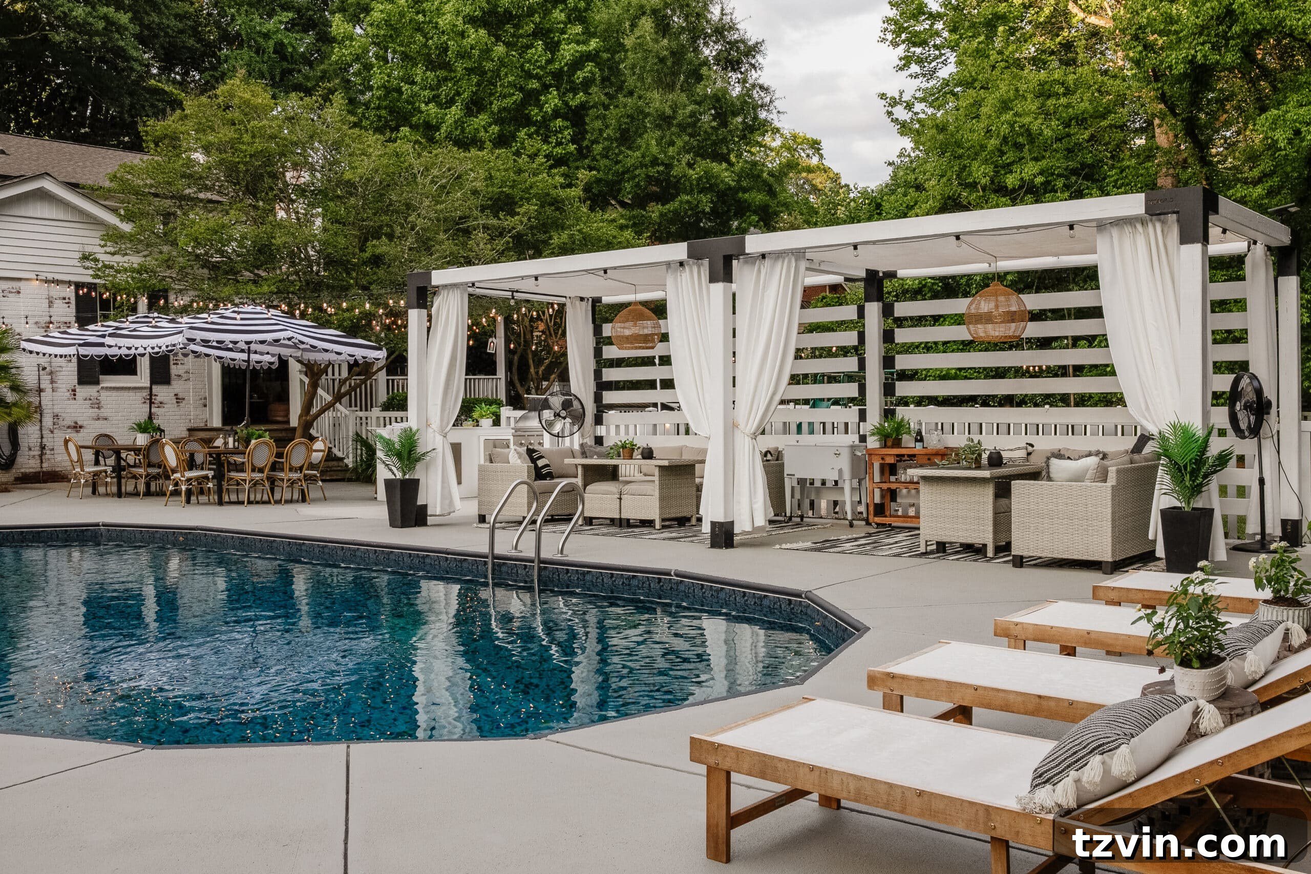backyard swimming pool with lounge chairs and cabana pergola