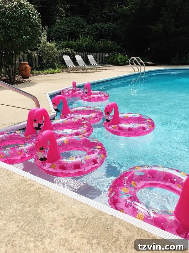 flamingo themed pool party using flamingo pool floats as decor and party favors