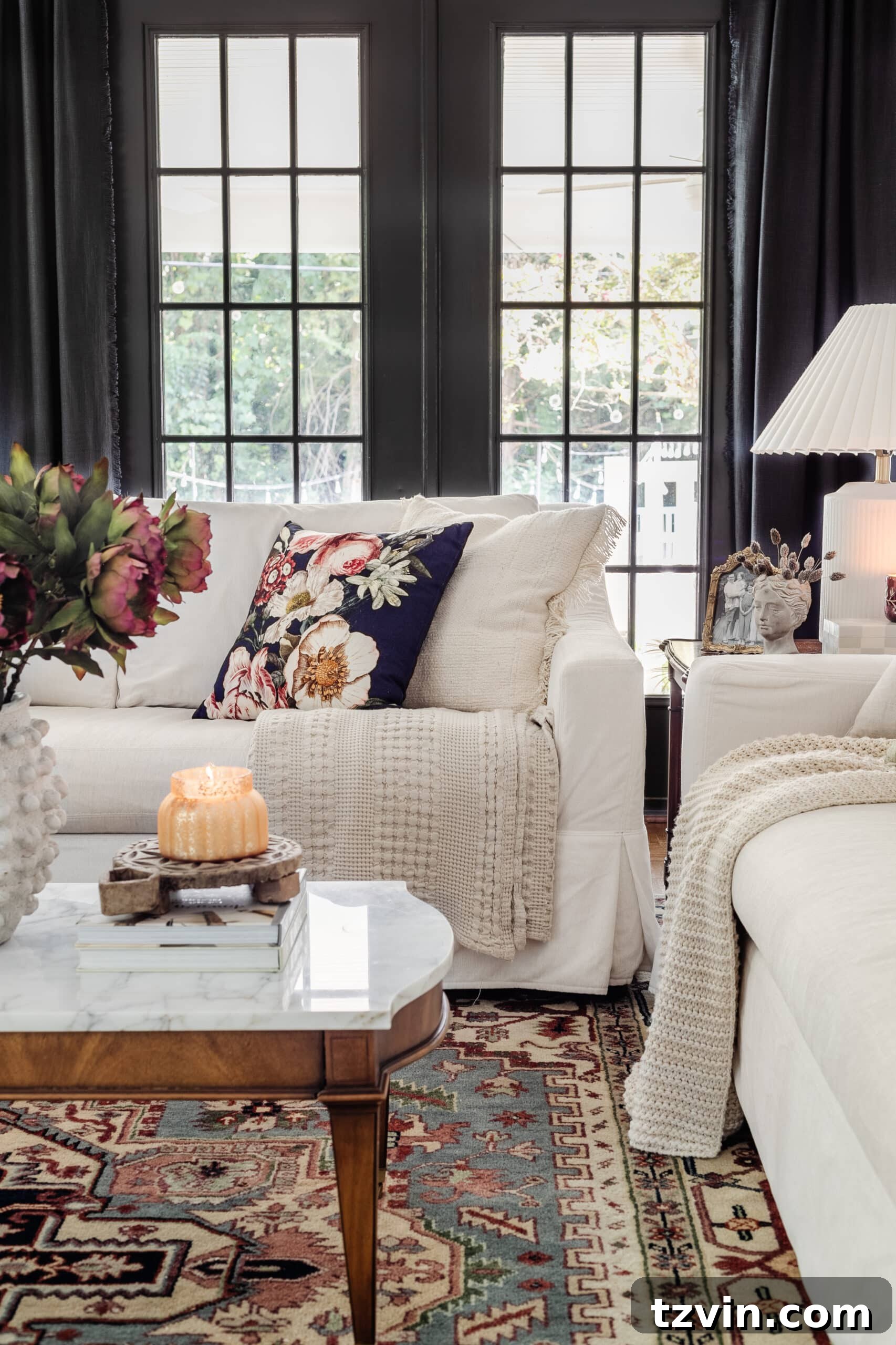 white living room sofas with navy floral pillow