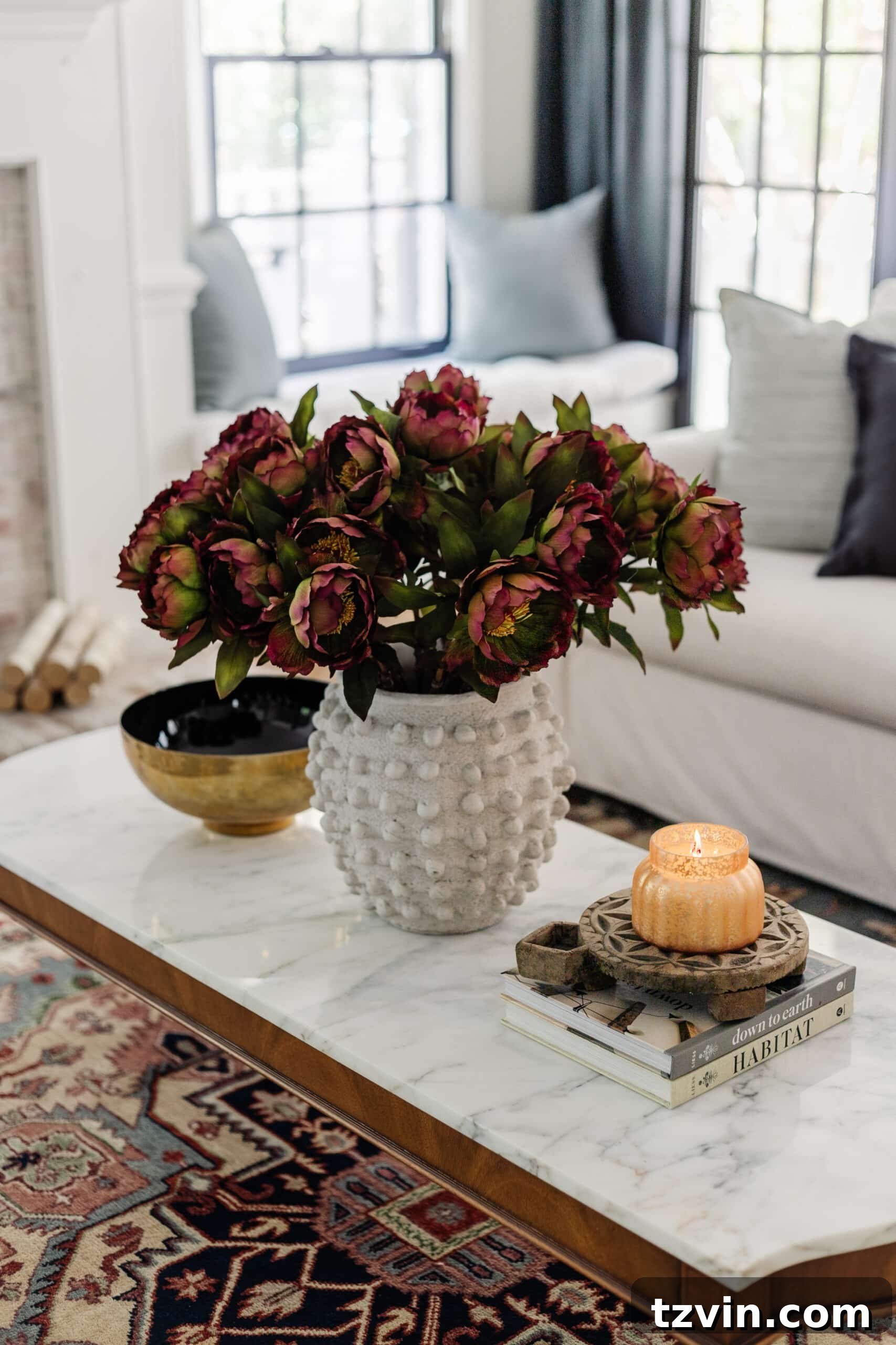 fall coffee table decor with vase of flowers and candle