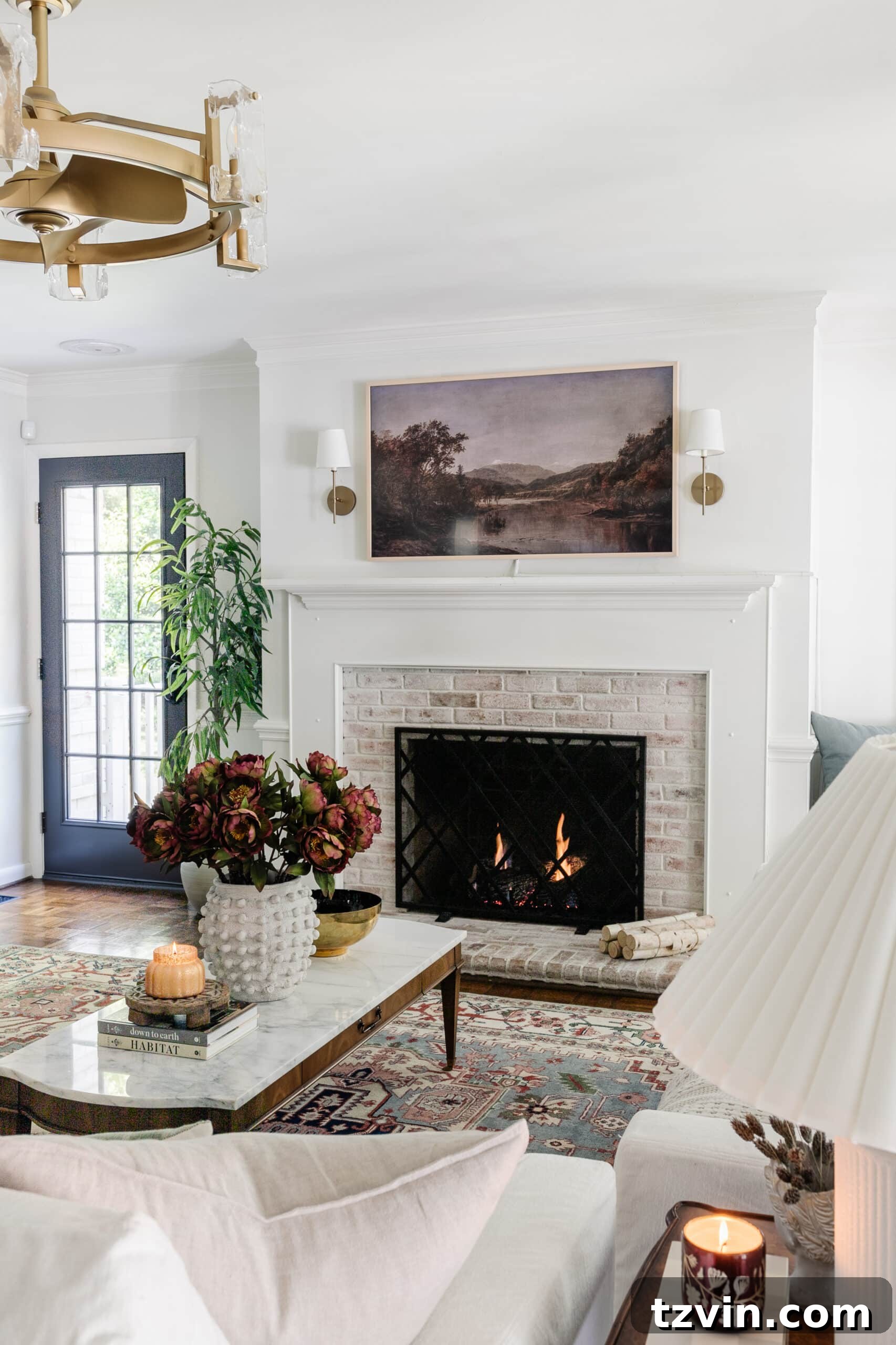 fall coffee table decor in a living room with limewashed brick fireplace