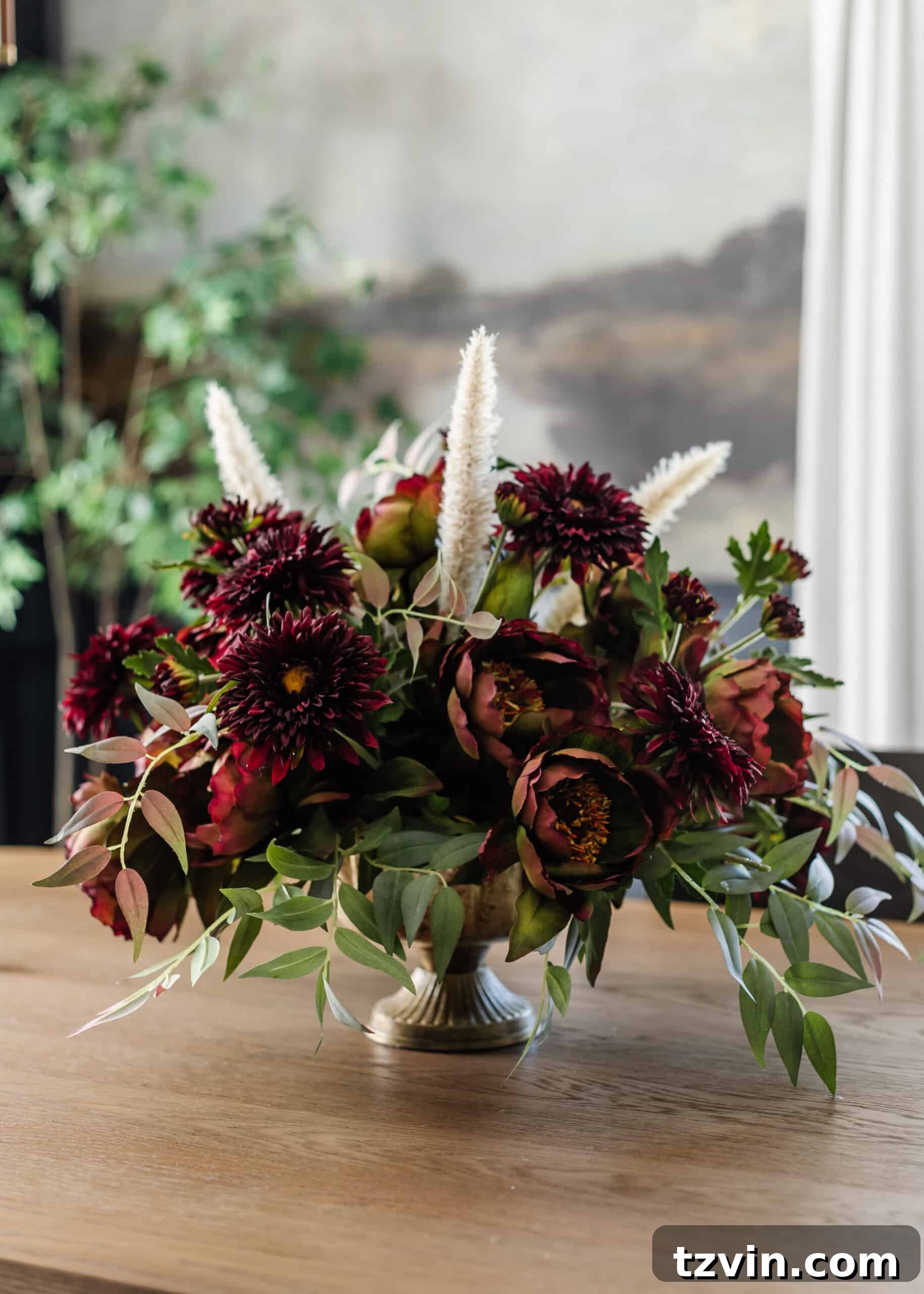 Your Guide to Crafting Beautiful Fall Floral Arrangements 3 A stunning burgundy and purple fall floral arrangement centerpiece