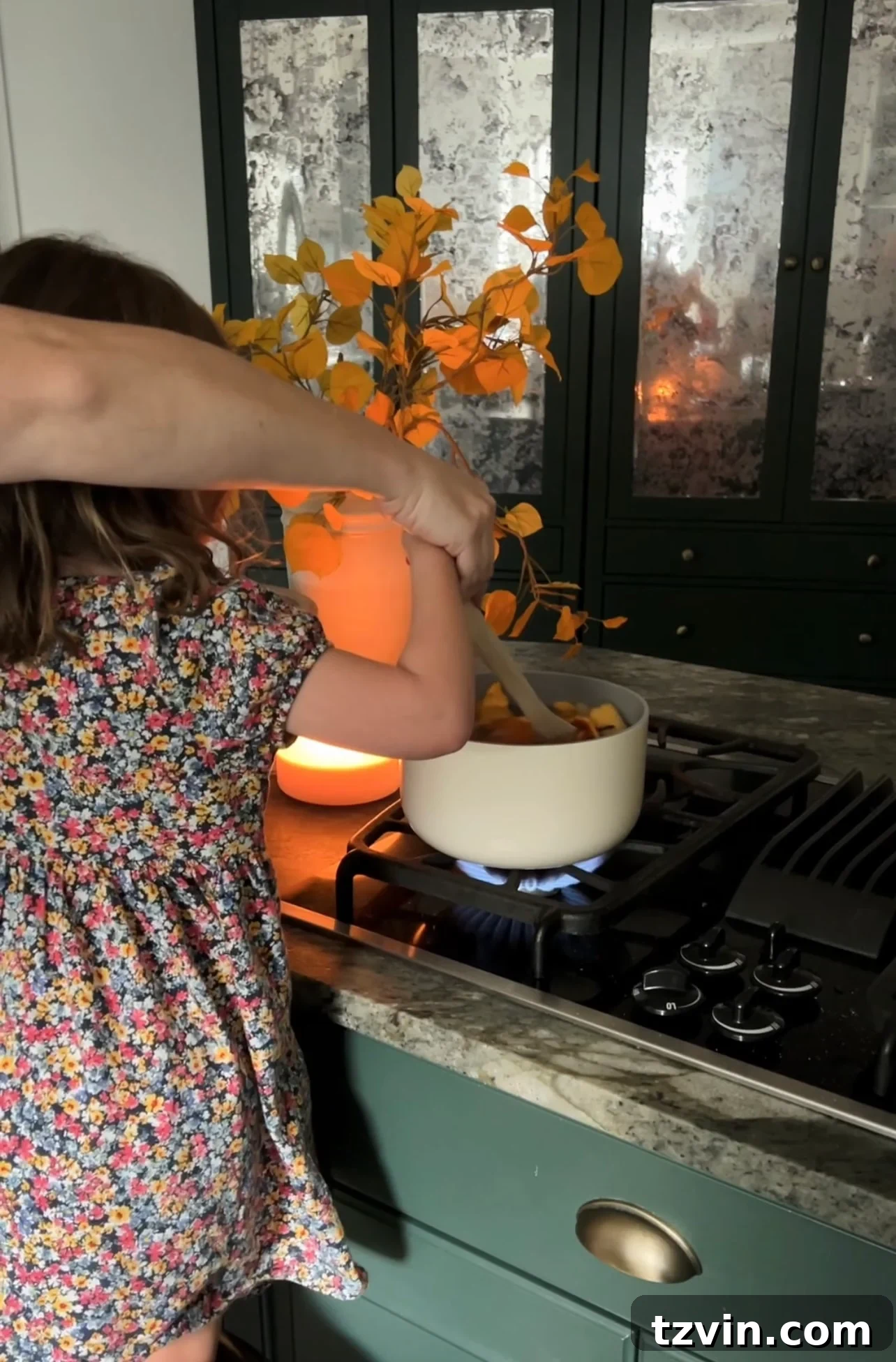 Sustainable Autumn Simmering Pot 7 stirring a pot of fall stovetop potpourri